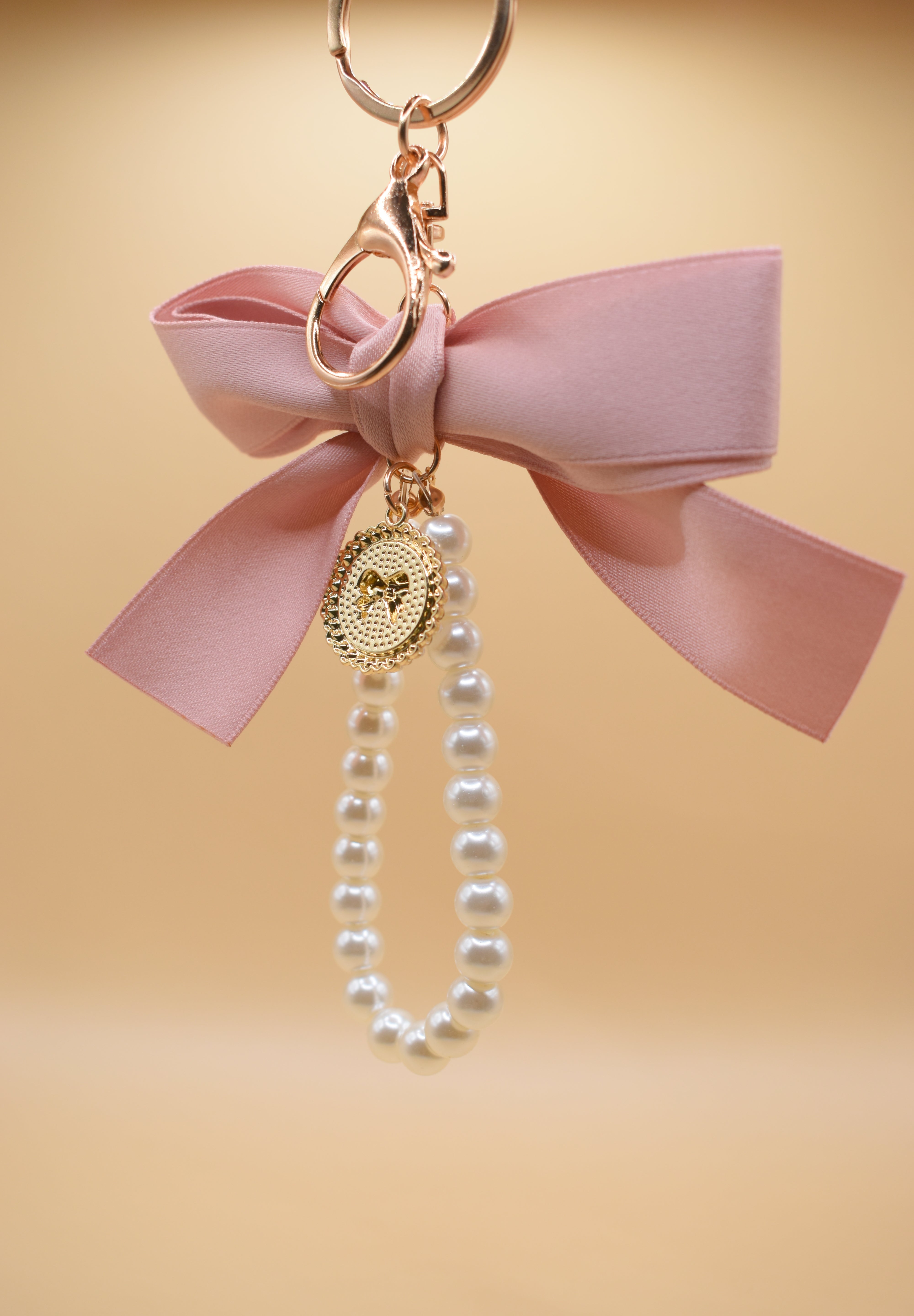 Gold bow with pearl bag charm clip accessory