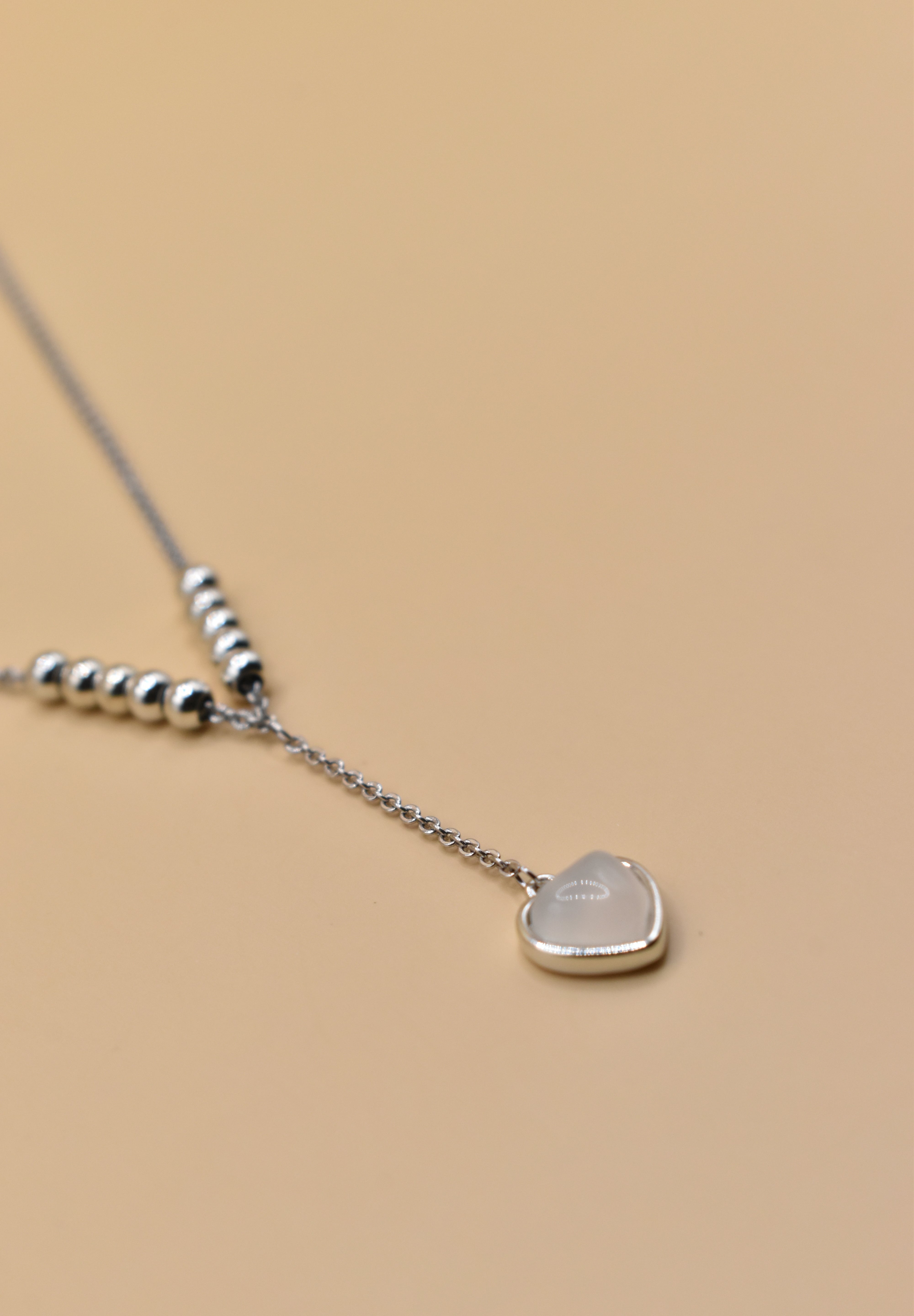 Heart necklace in rhodium stainless steel with drop pendant