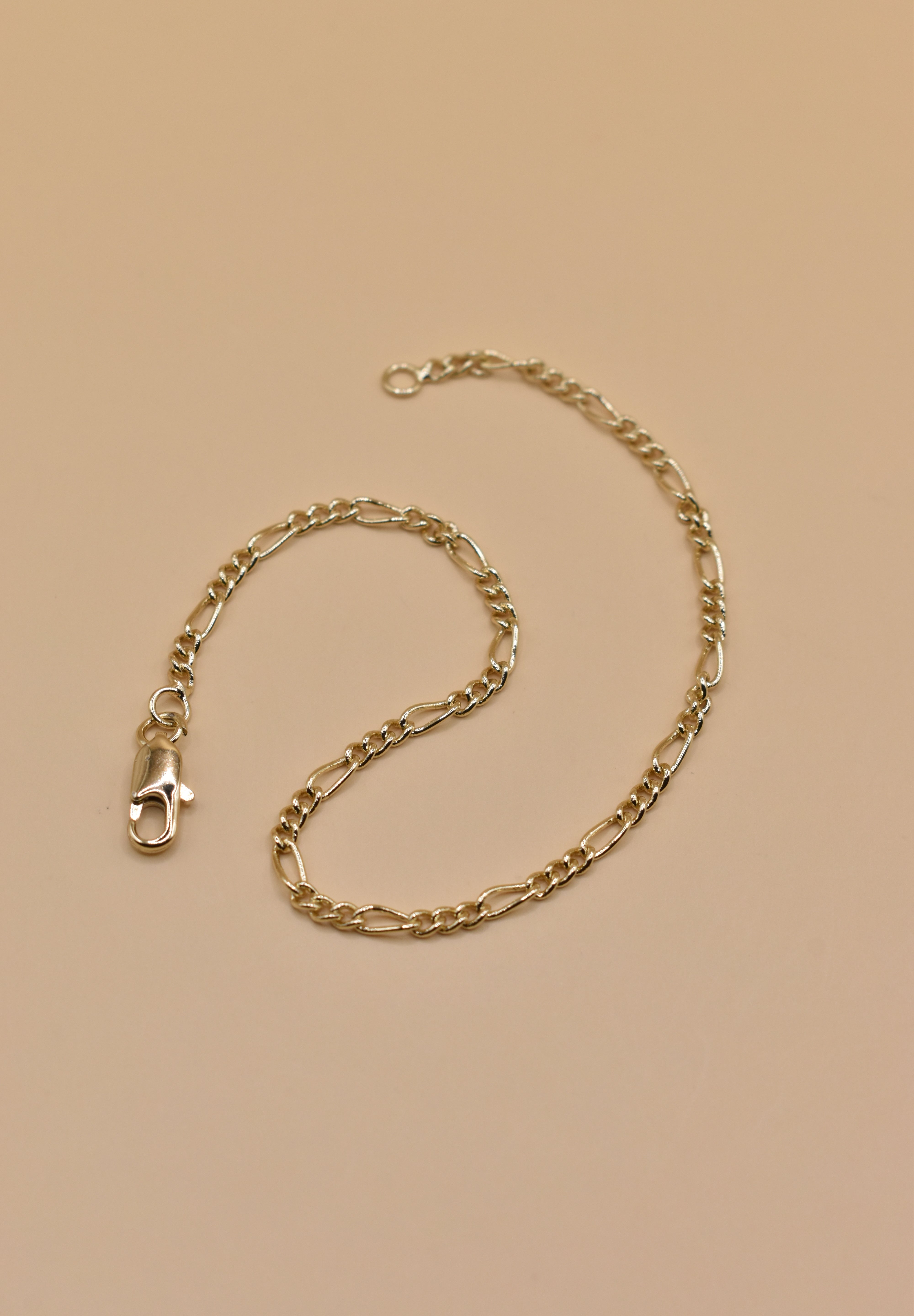 Thin gold chain bracelet with dainty link design