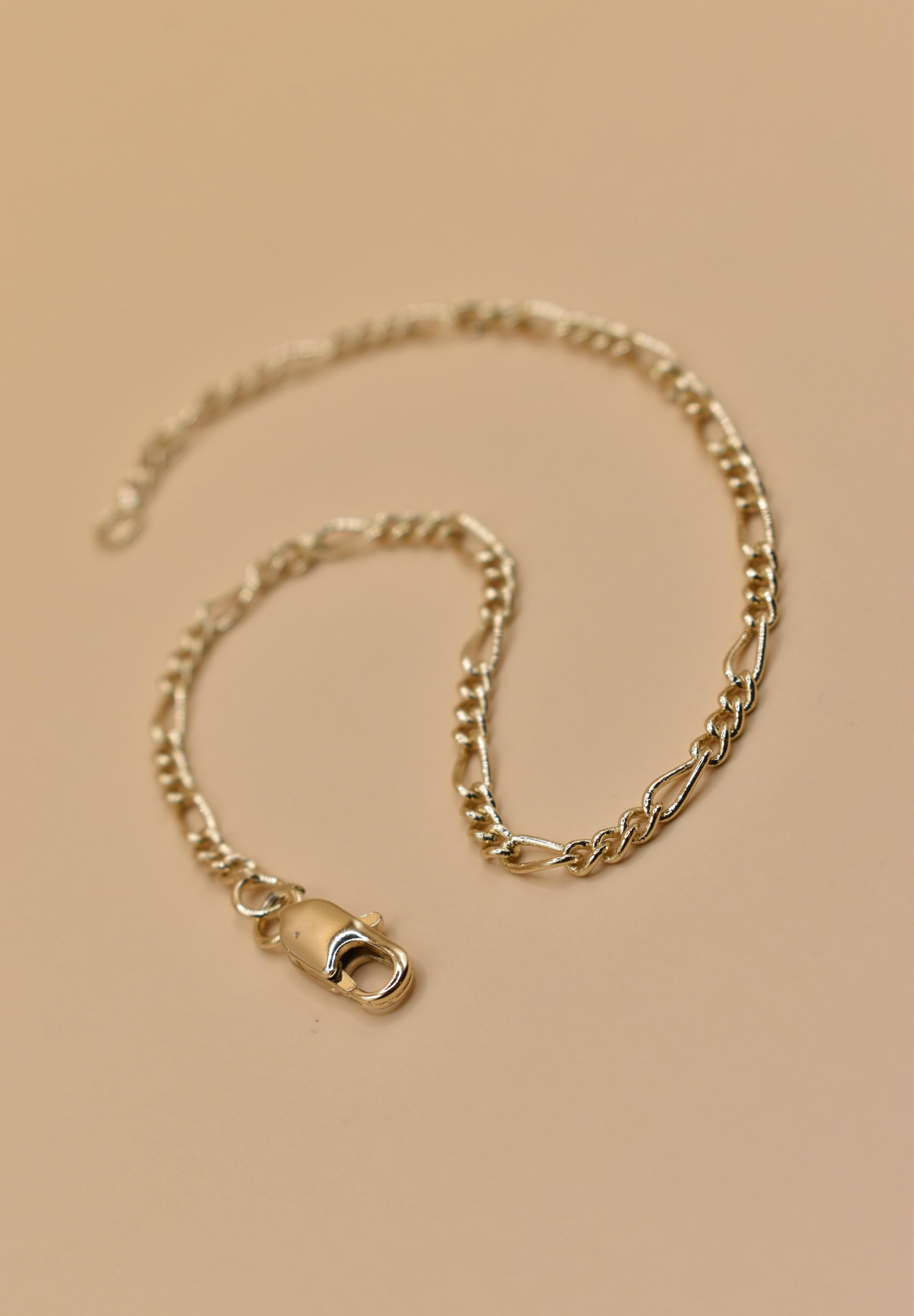 Thin gold chain bracelet with dainty link design