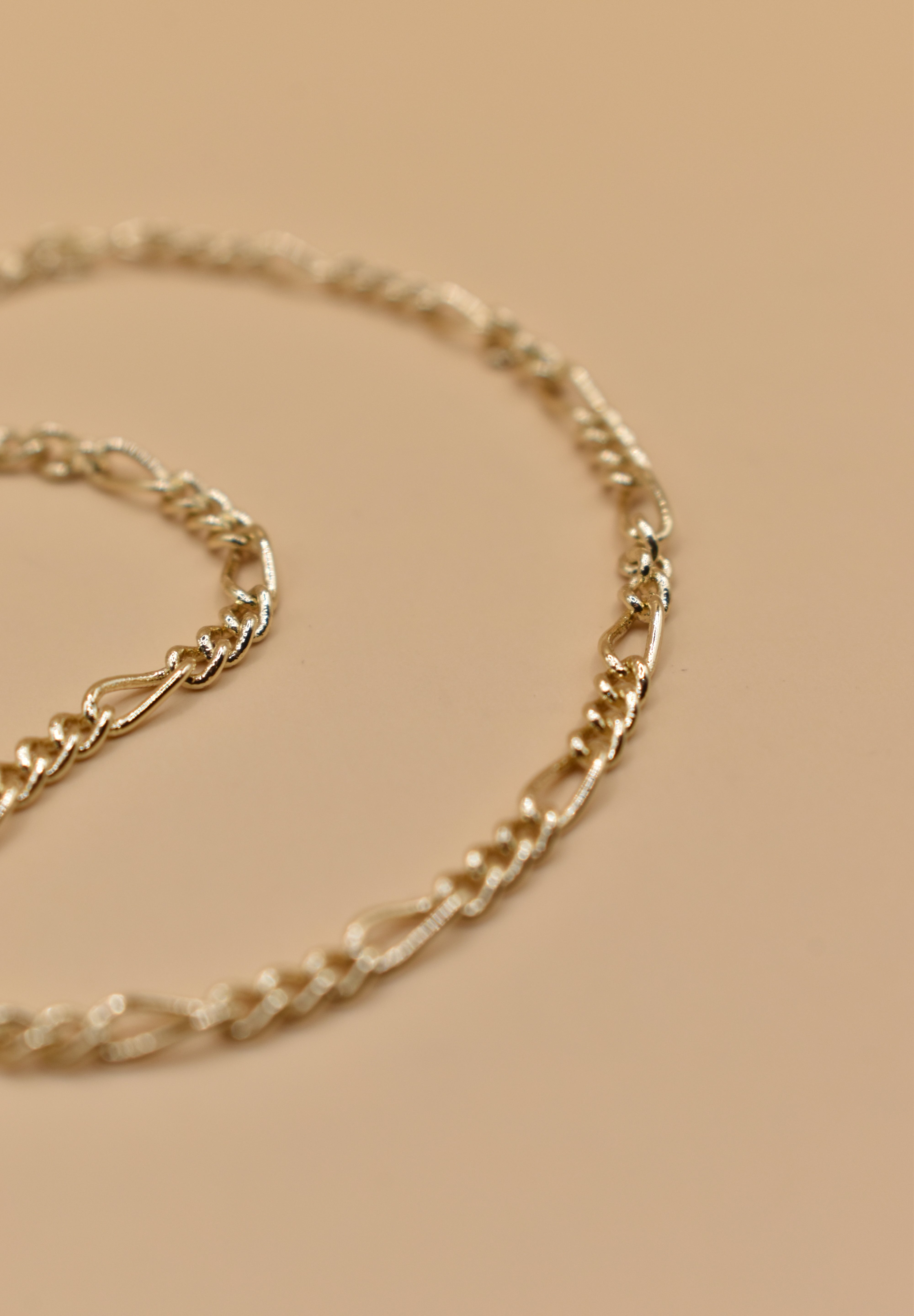 Thin gold chain bracelet with dainty link design