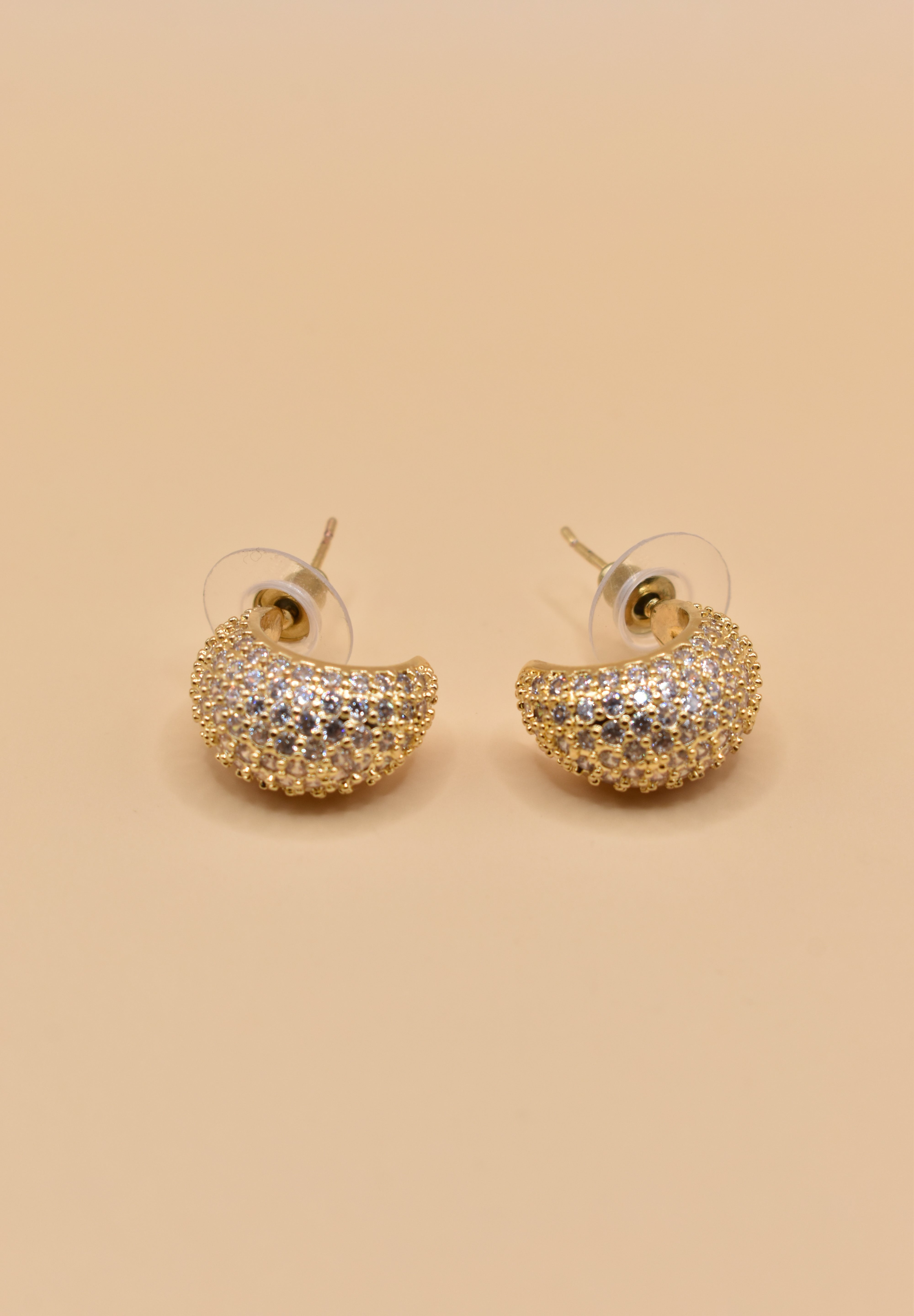 Gold dome rhinestone earrings with structured stud design