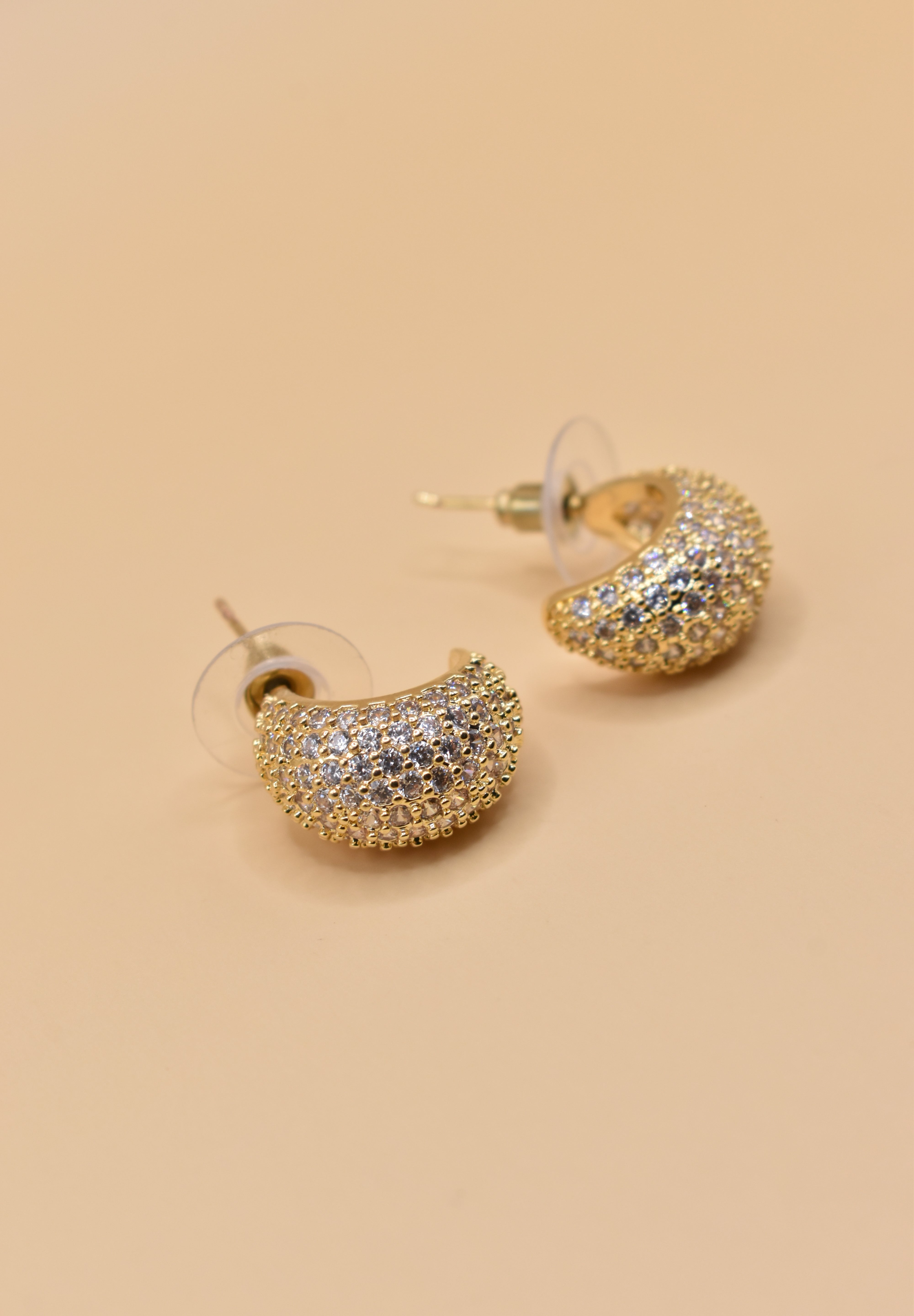 Gold dome rhinestone earrings with structured stud design