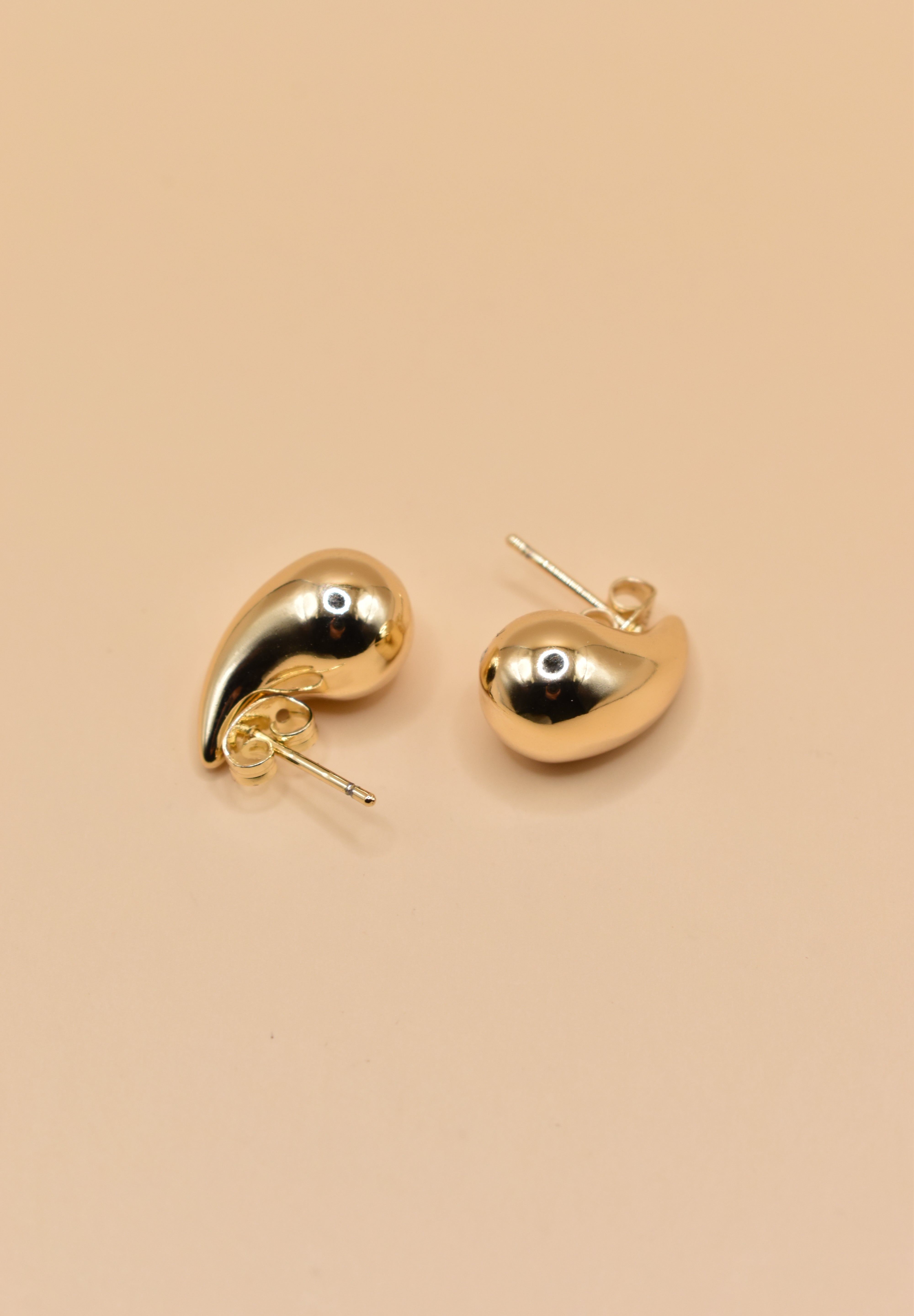 Small gold tear drop earrings in stainless steel finish