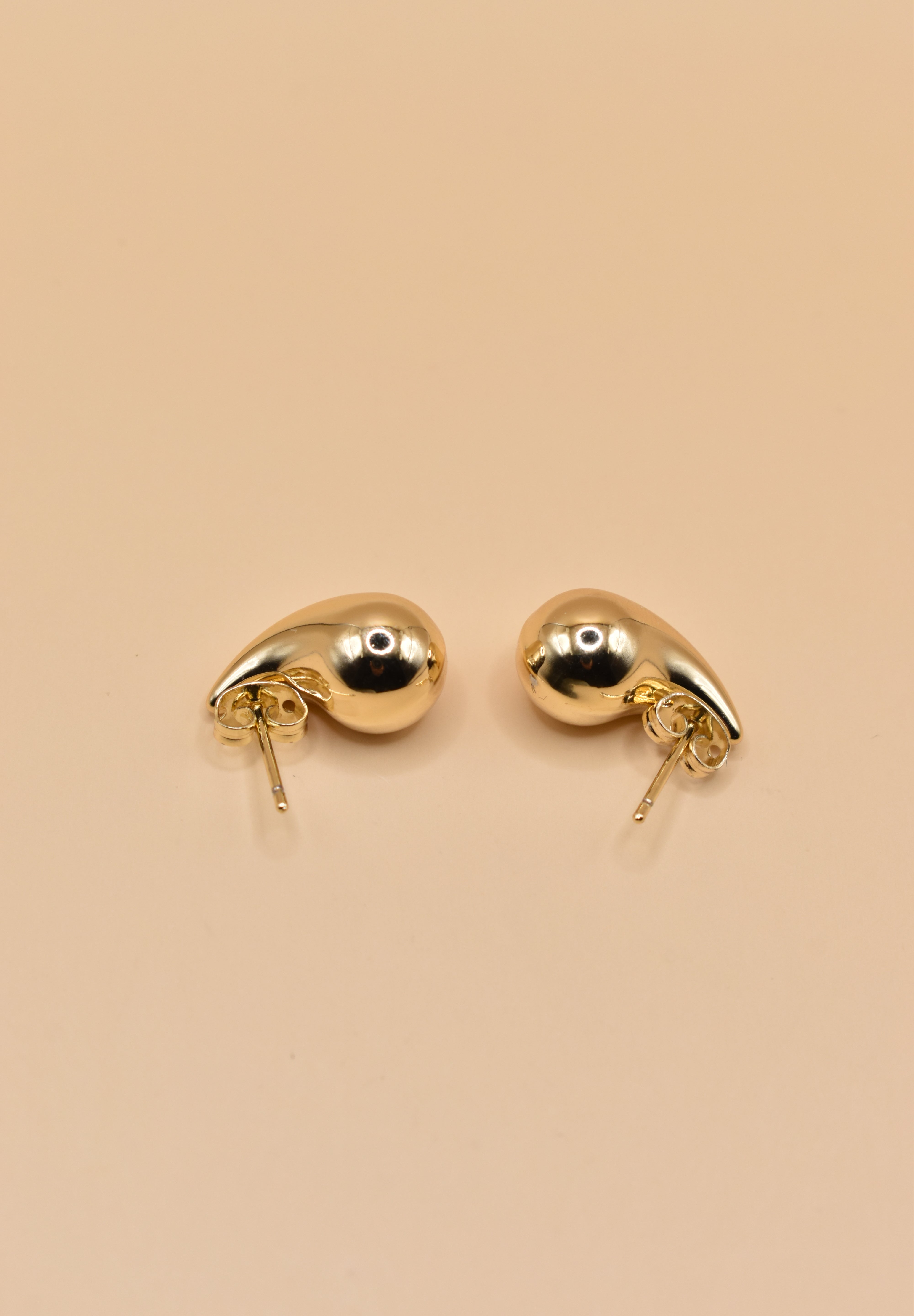 Small gold tear drop earrings in stainless steel finish