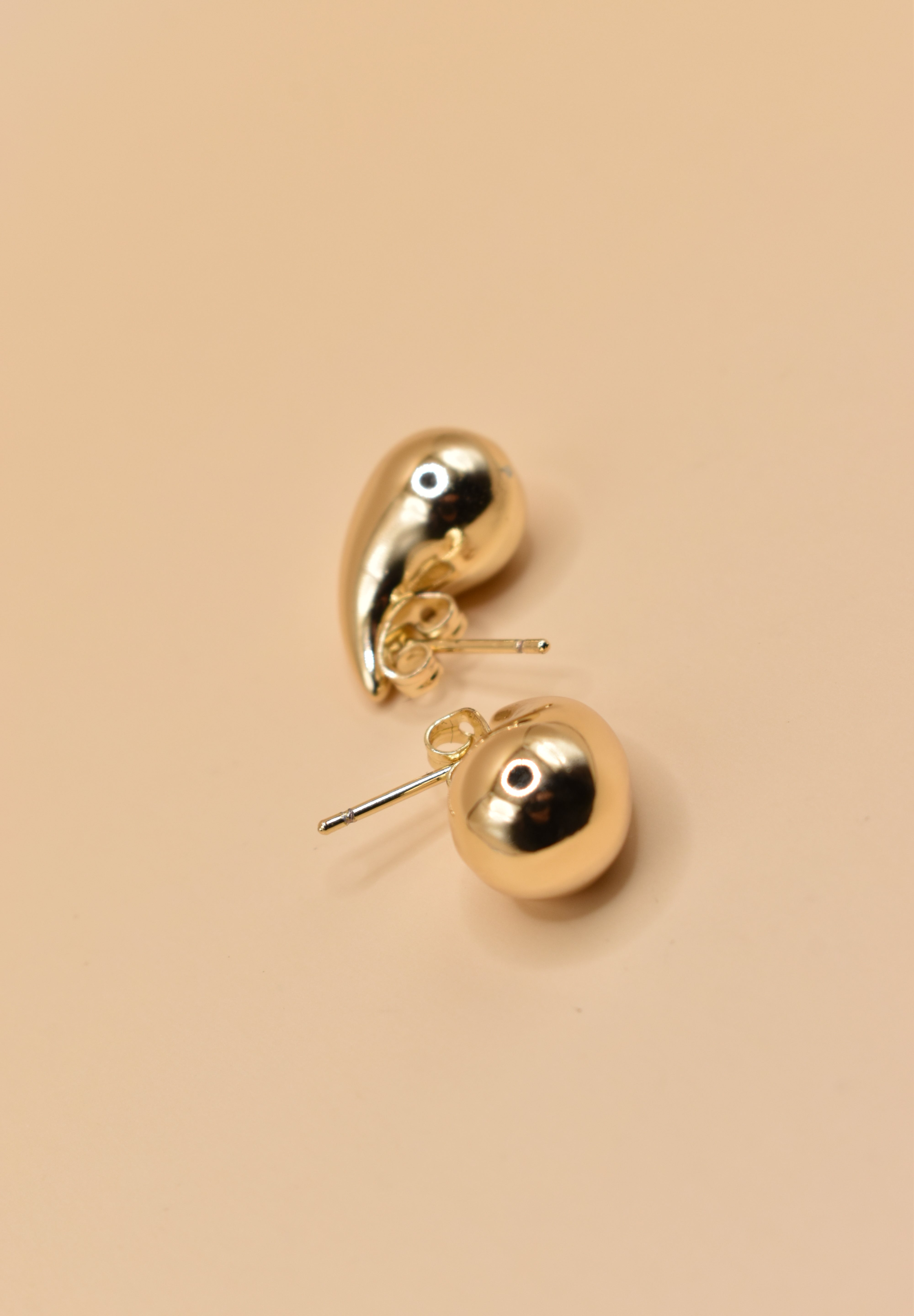 Small gold tear drop earrings in stainless steel finish