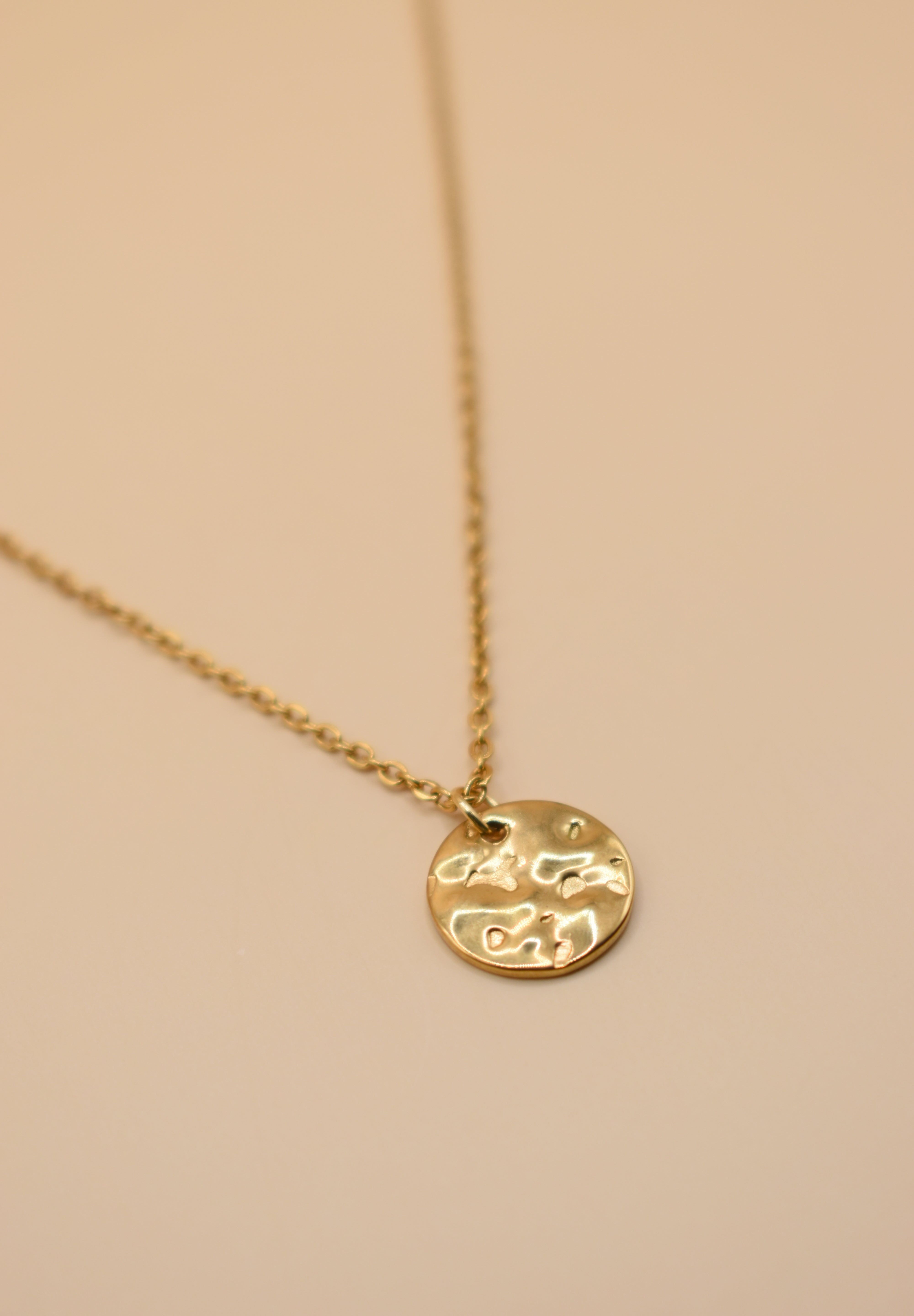 Hammered gold round pendant necklace on dainty gold chain