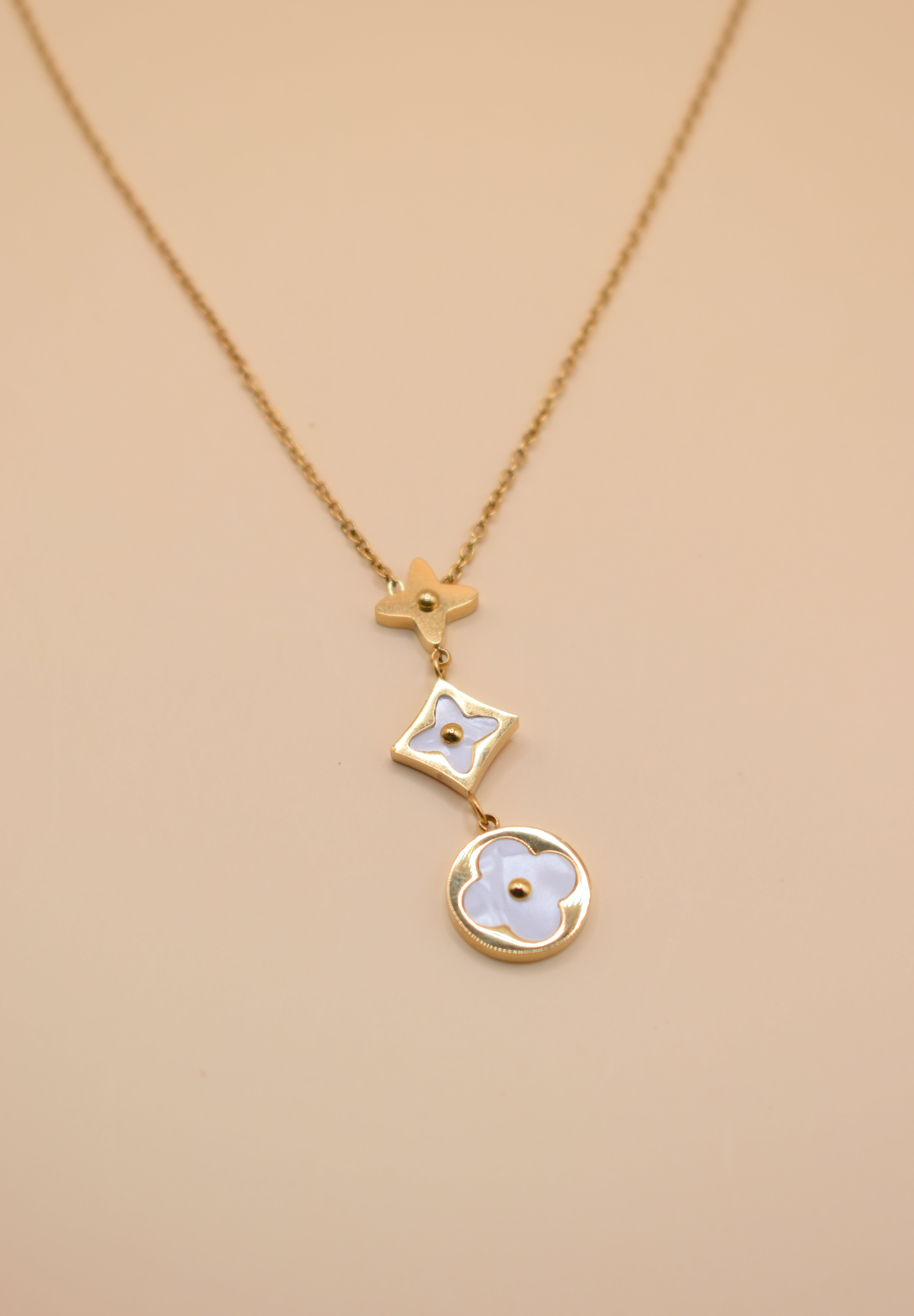 White flower pendant on dainty gold necklace chain