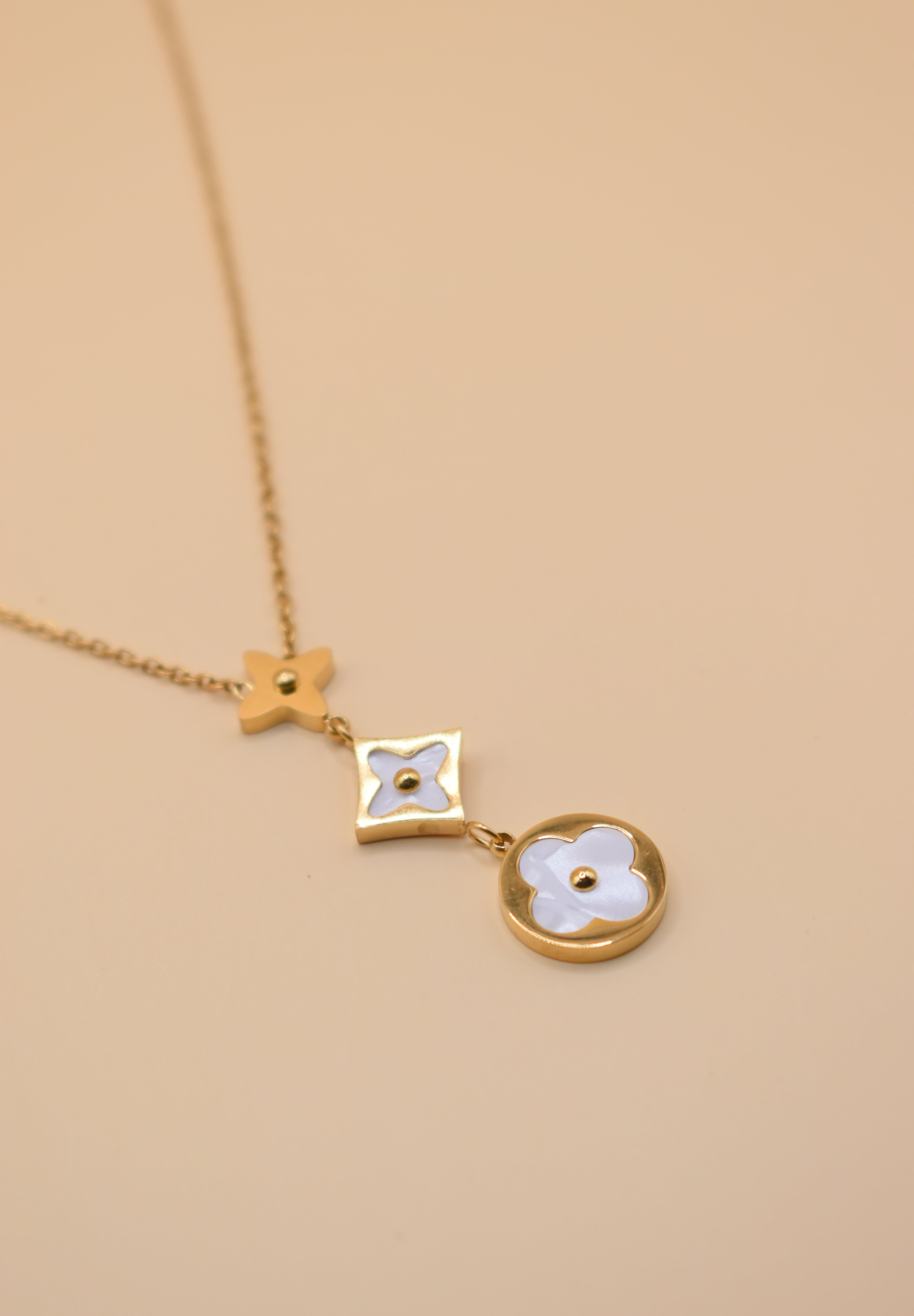 White flower pendant on dainty gold necklace chain