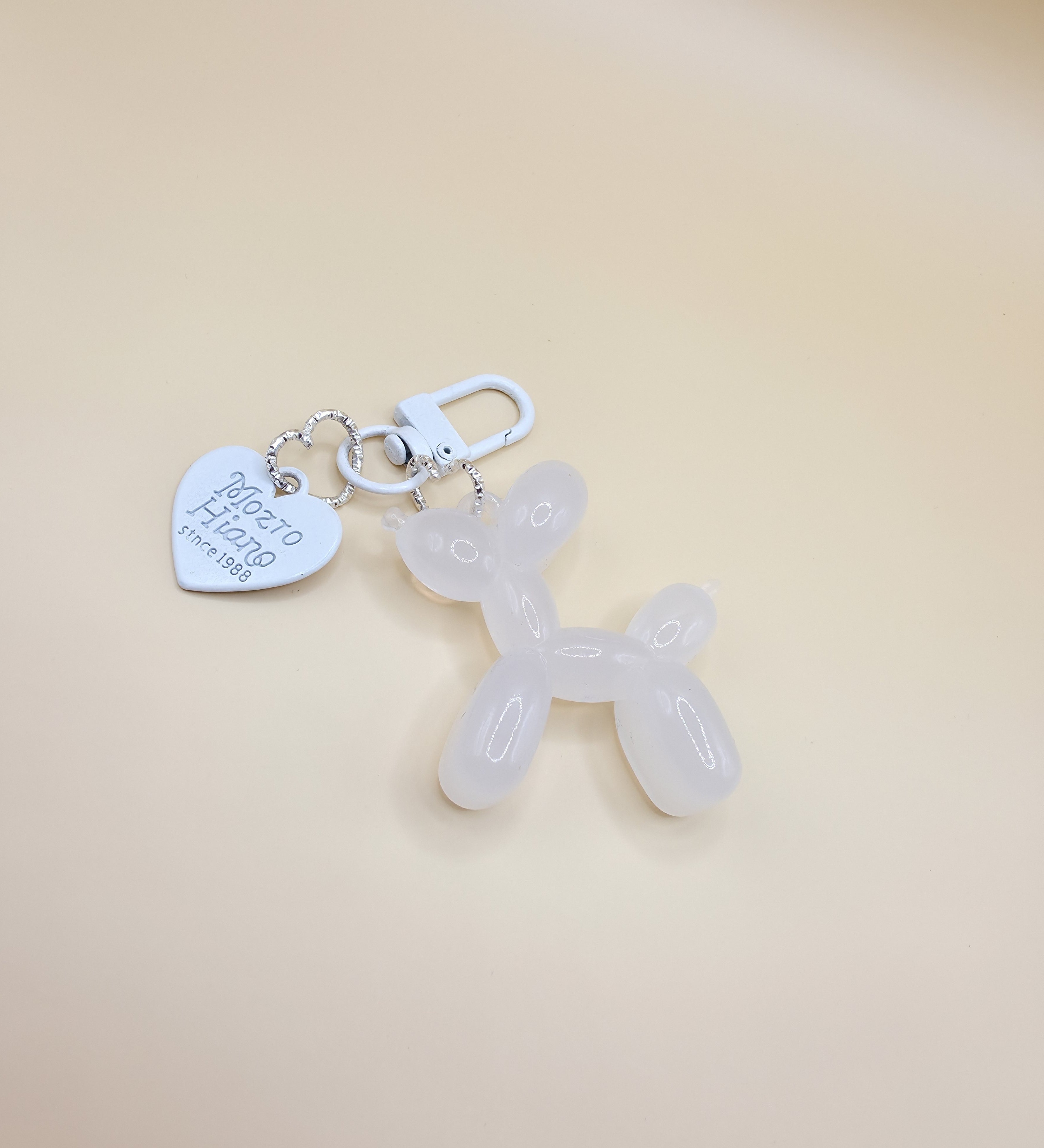 White balloon dog bag charm with gold clip for handbags