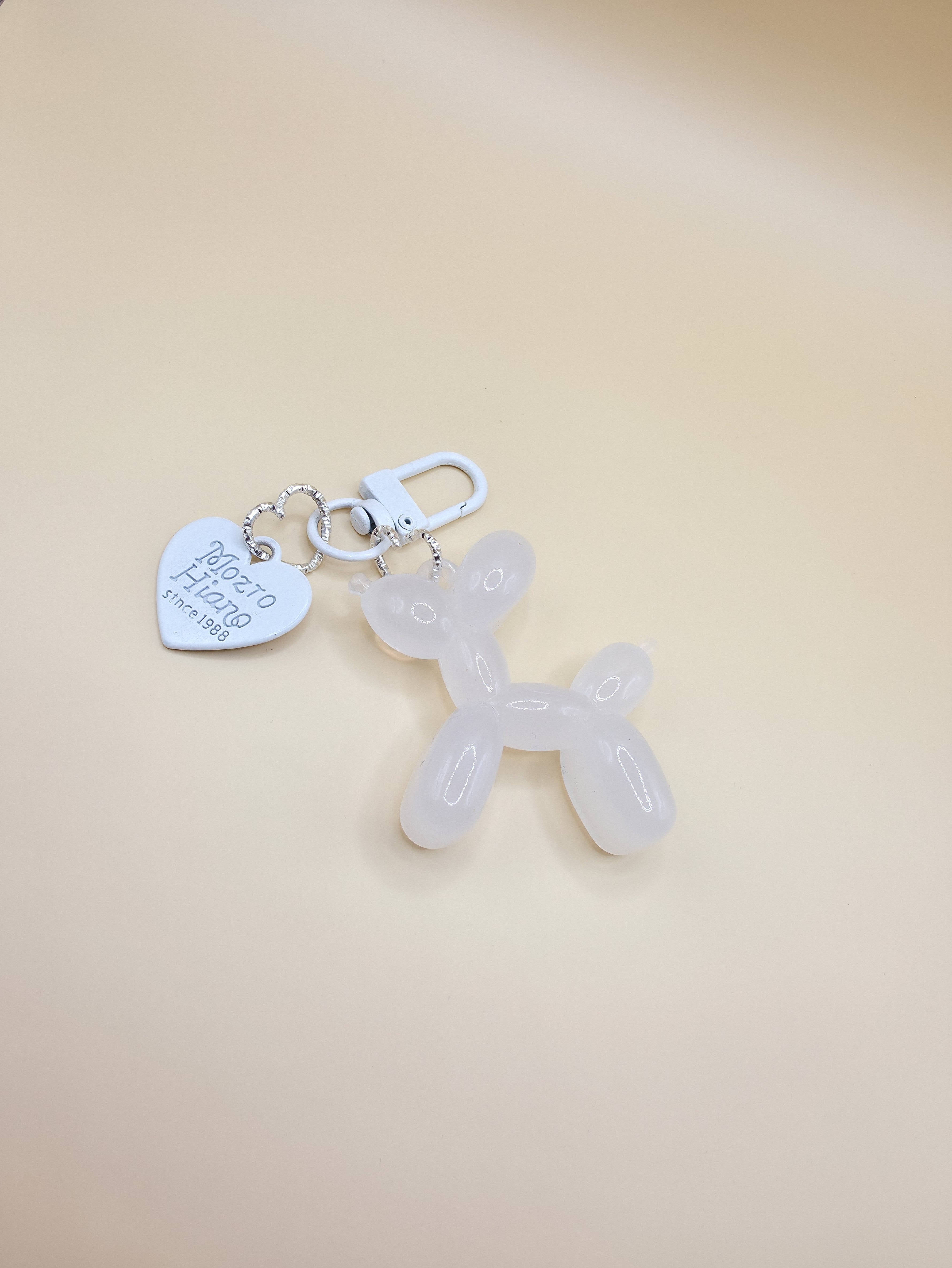 White balloon dog bag charm with gold clip for handbags