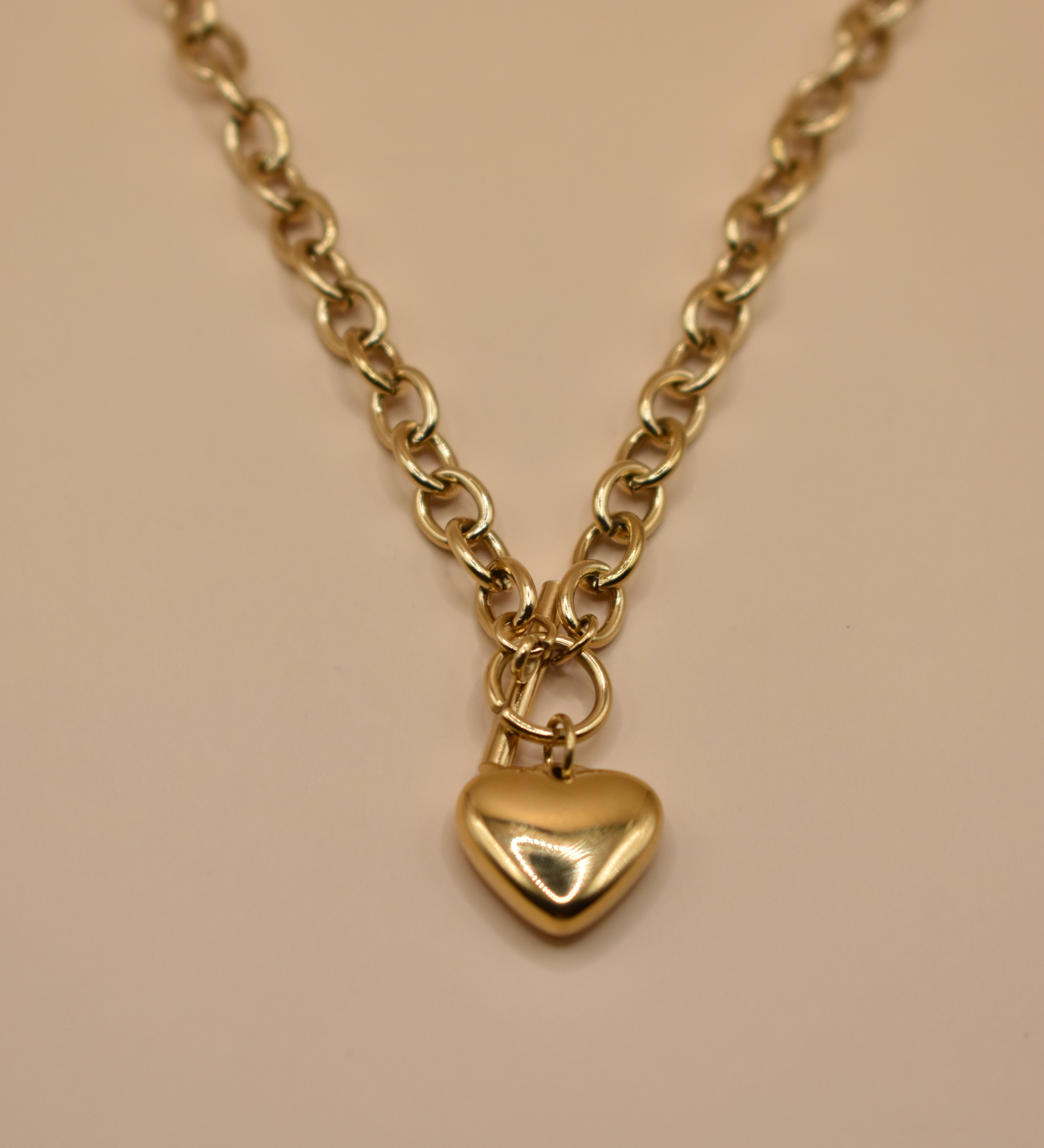 Gold heart pendant necklace on 18K plated chain