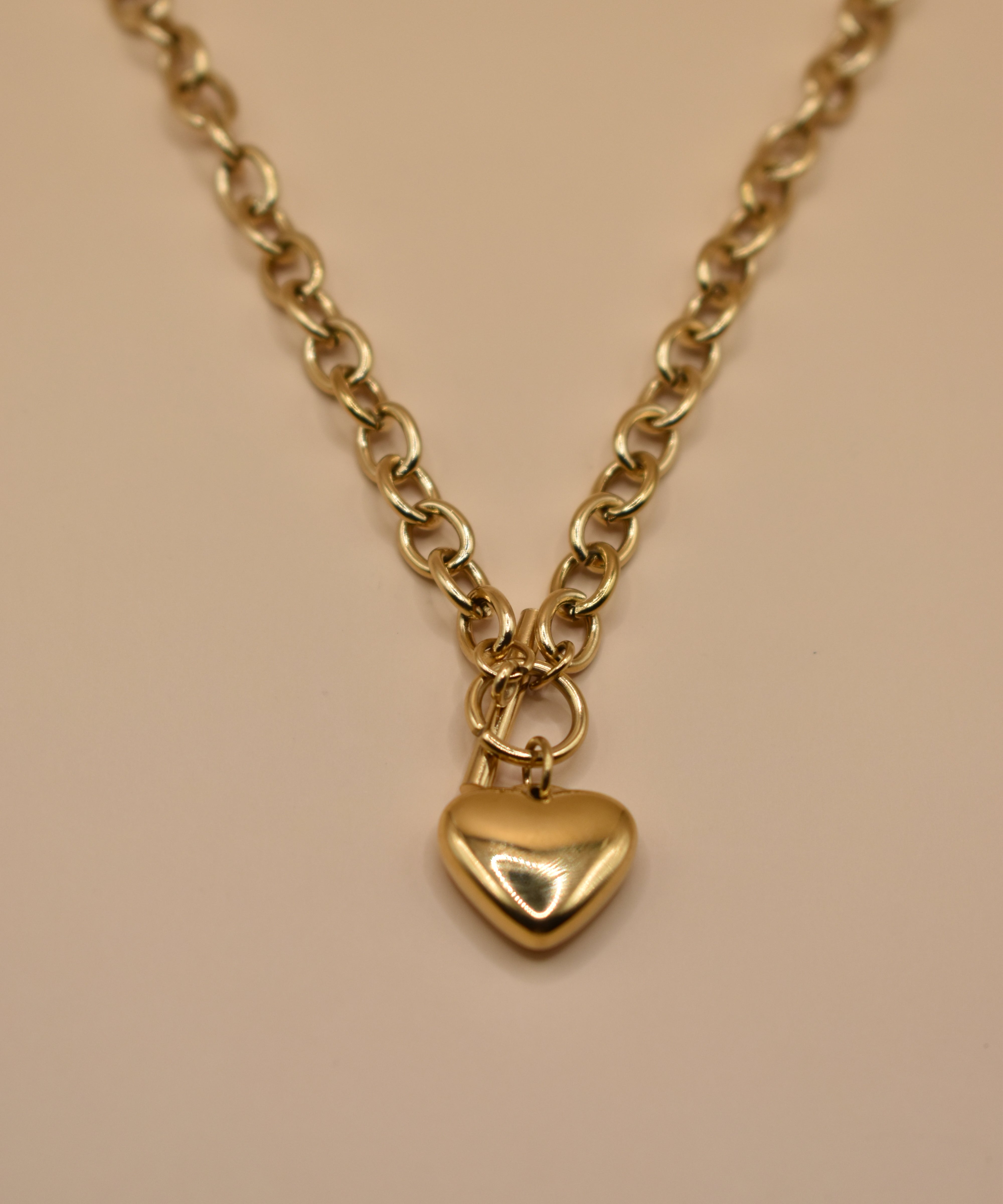 Gold heart pendant necklace on 18K plated chain
