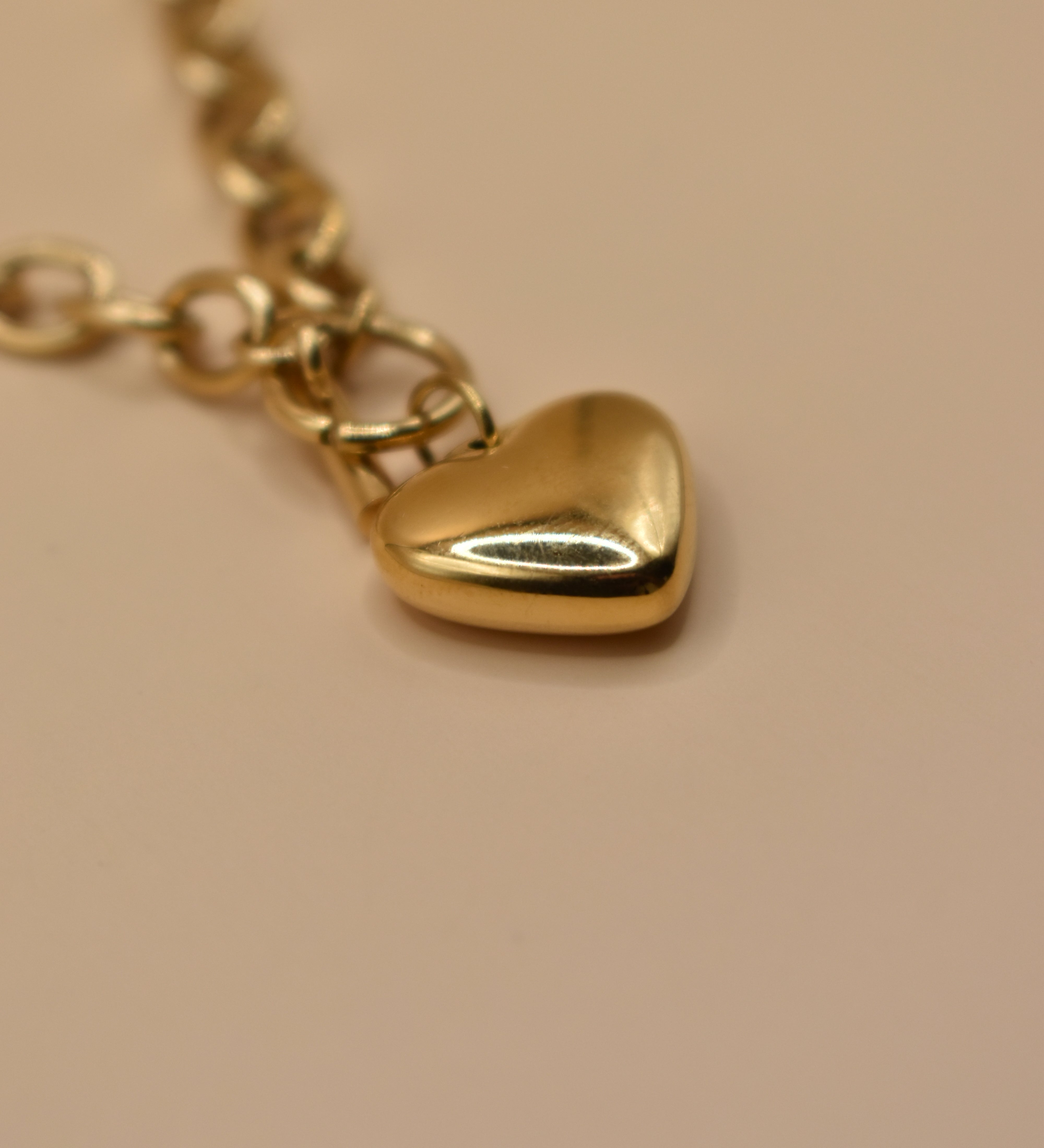 Gold heart pendant necklace on 18K plated chain
