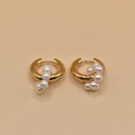 Pearl statement huggies earrings with secure closure