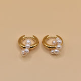 Pearl statement huggies earrings with secure closure