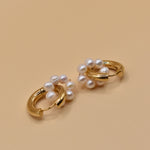 Pearl statement huggies earrings with secure closure