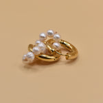 Pearl statement huggies earrings with secure closure