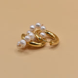 Pearl statement huggies earrings with secure closure