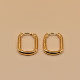 Gold U Huggies Earrings with curved hoop charm design