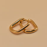 Gold U Huggies Earrings with curved hoop charm design