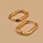 Gold U Huggies Earrings with curved hoop charm design
