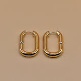Gold U Huggies Earrings with curved hoop charm design