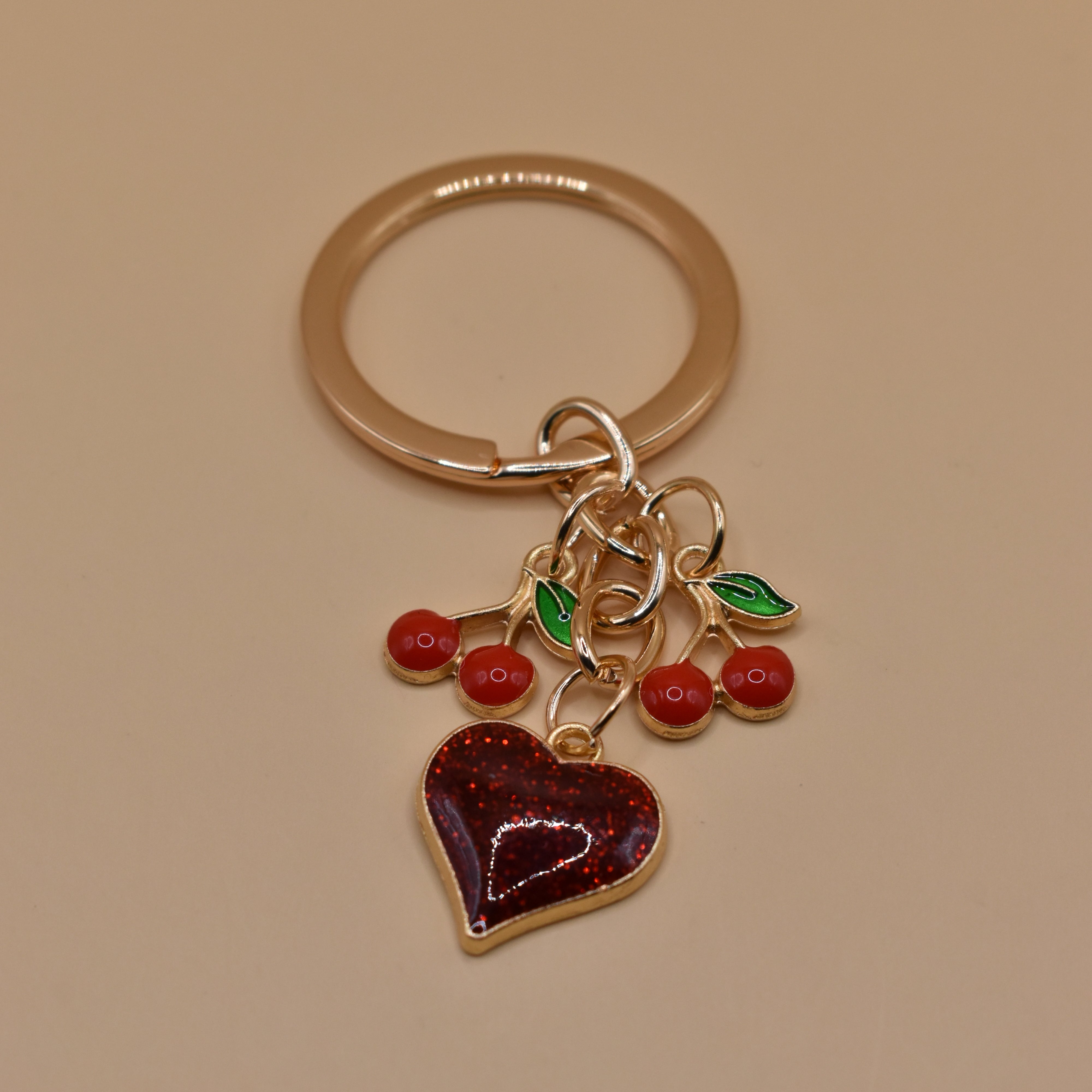 Cherry bag charm keychain with red gloss and heart detail