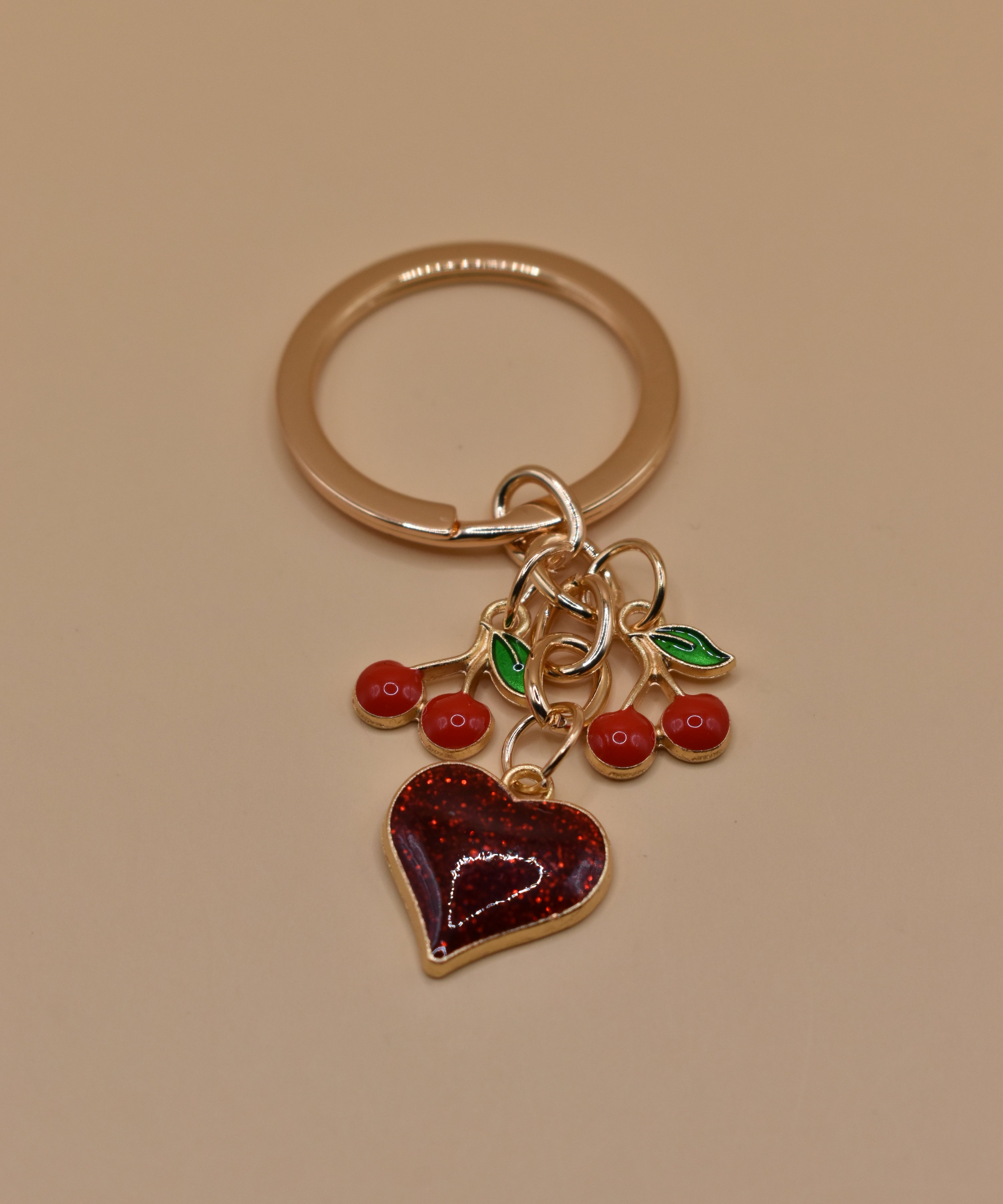 Cherry bag charm keychain with red gloss and heart detail