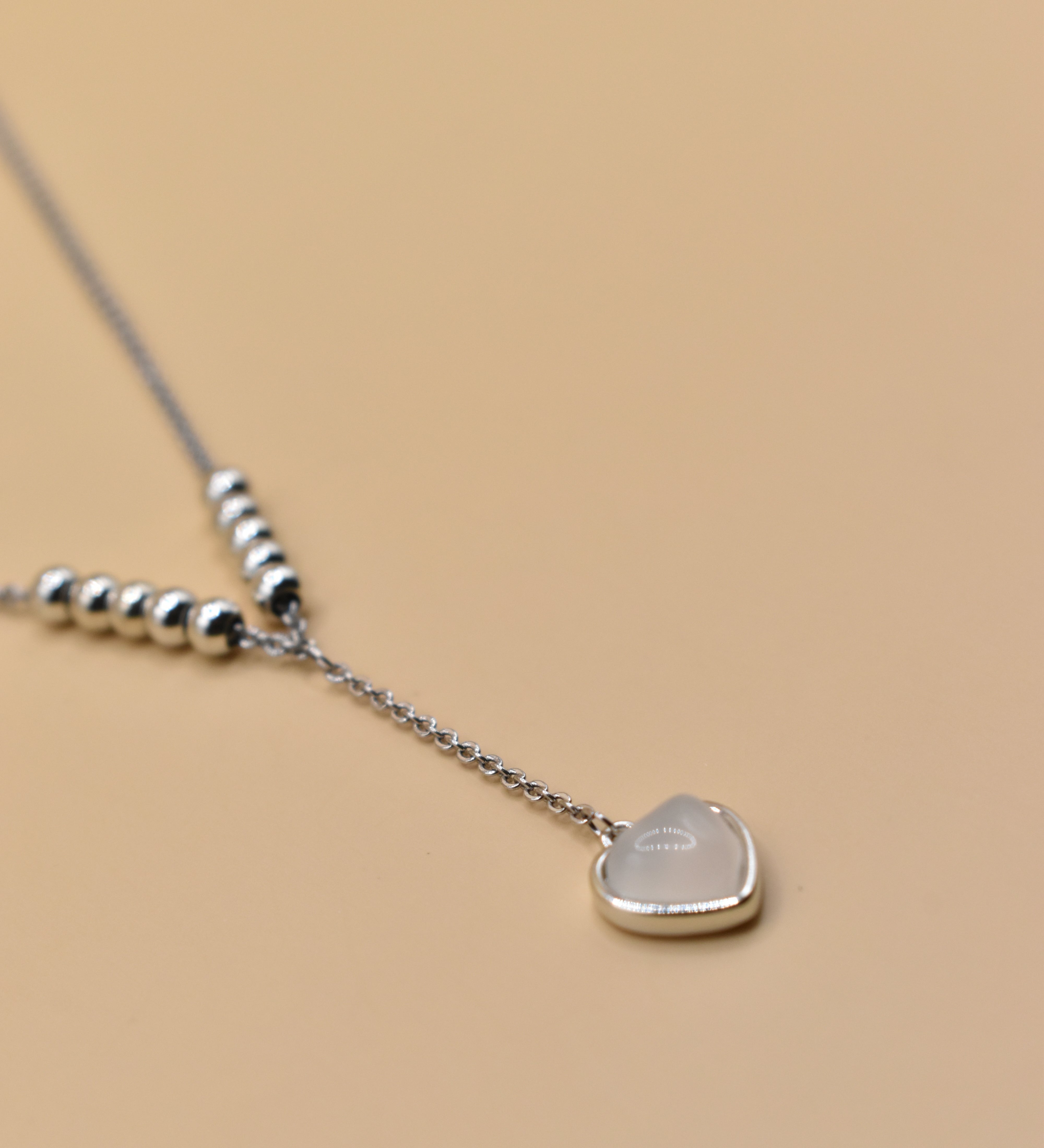 Heart necklace in rhodium stainless steel with drop pendant