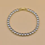 Gold tennis bracelet with green emerald zircon stones