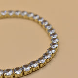 Gold tennis bracelet with green emerald zircon stones