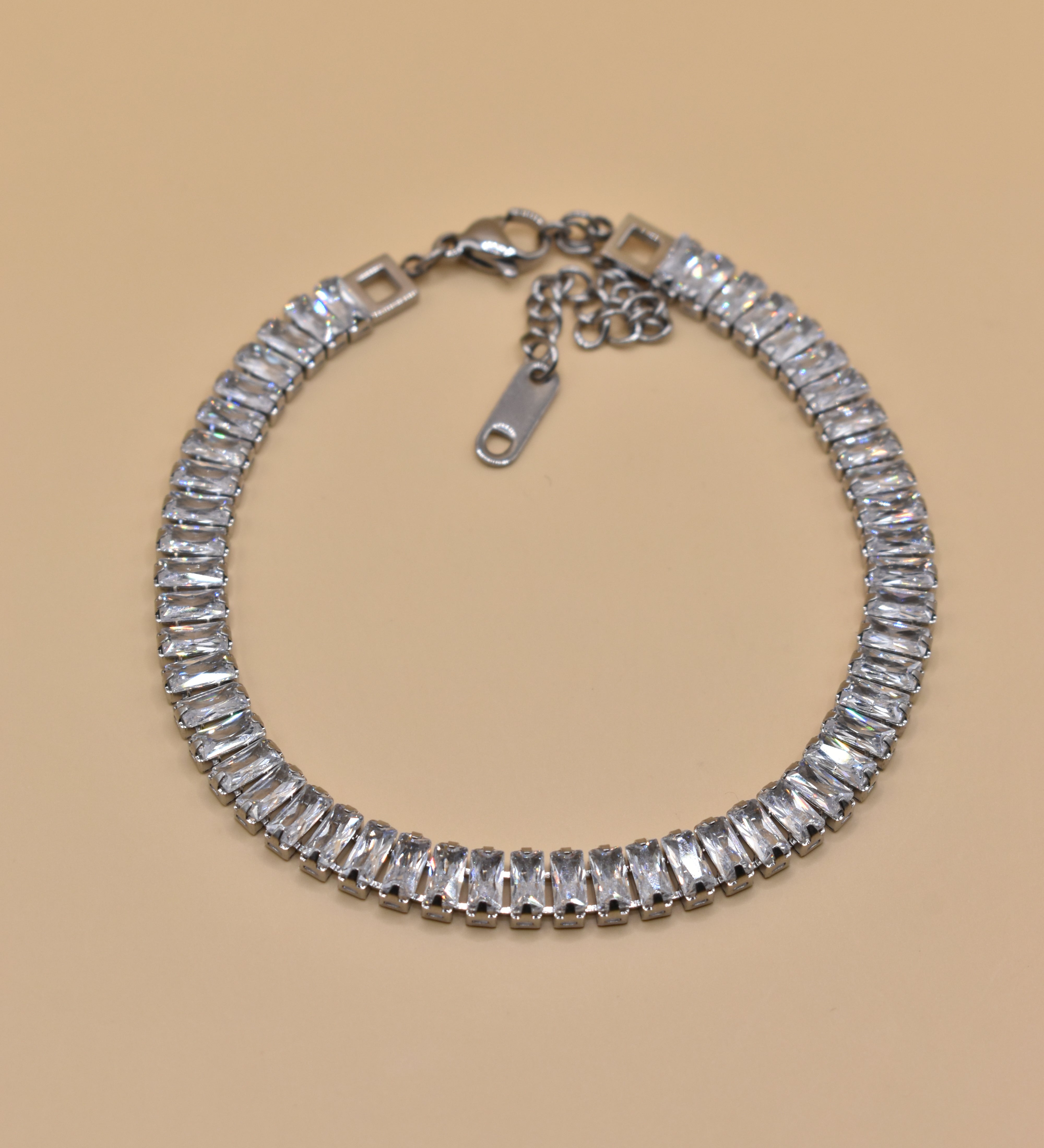 CZ tennis bracelet with stainless steel and baguette stones