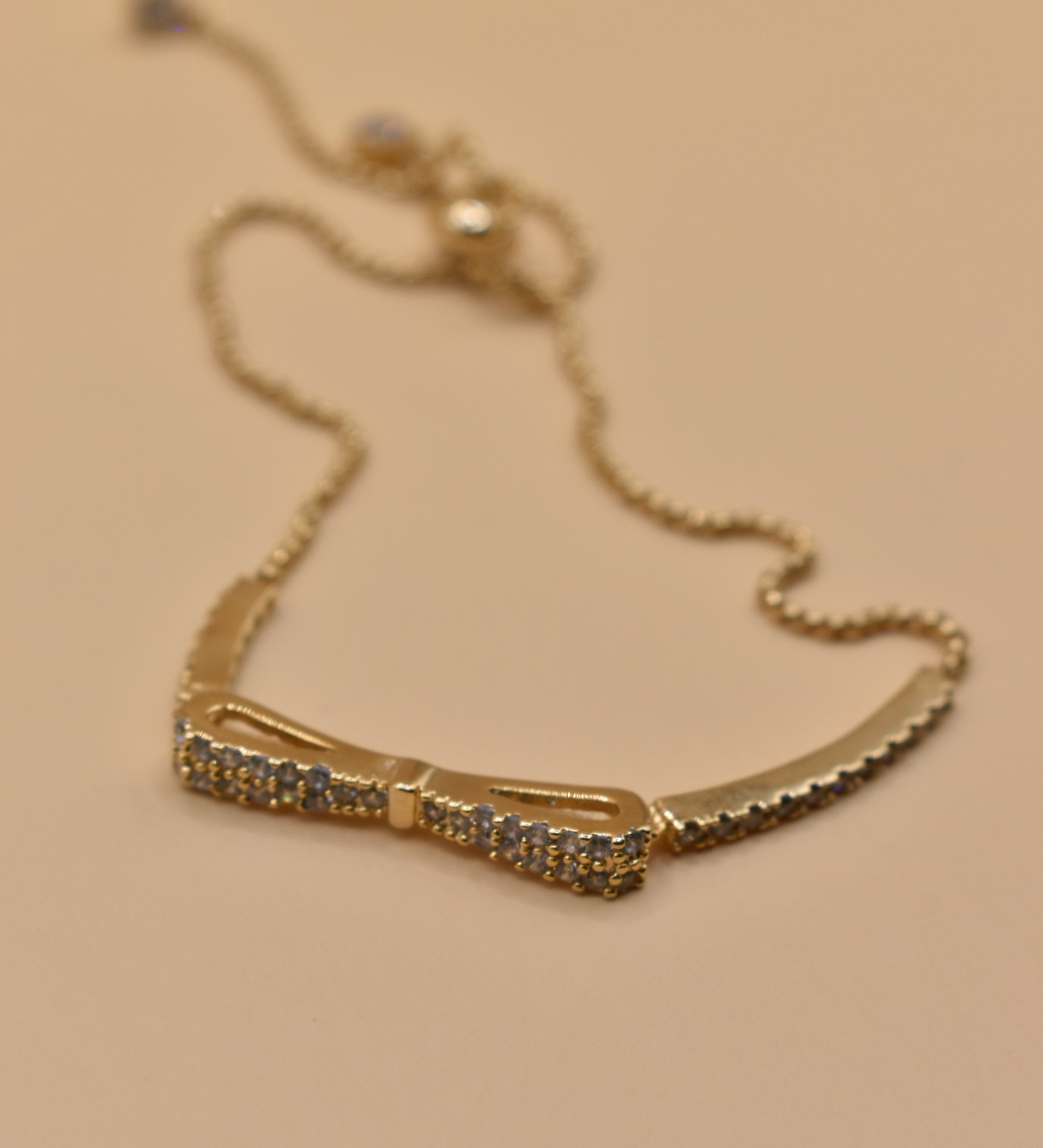 Gold Bow CZ Bracelet Adjustable with cubic zirconia charm