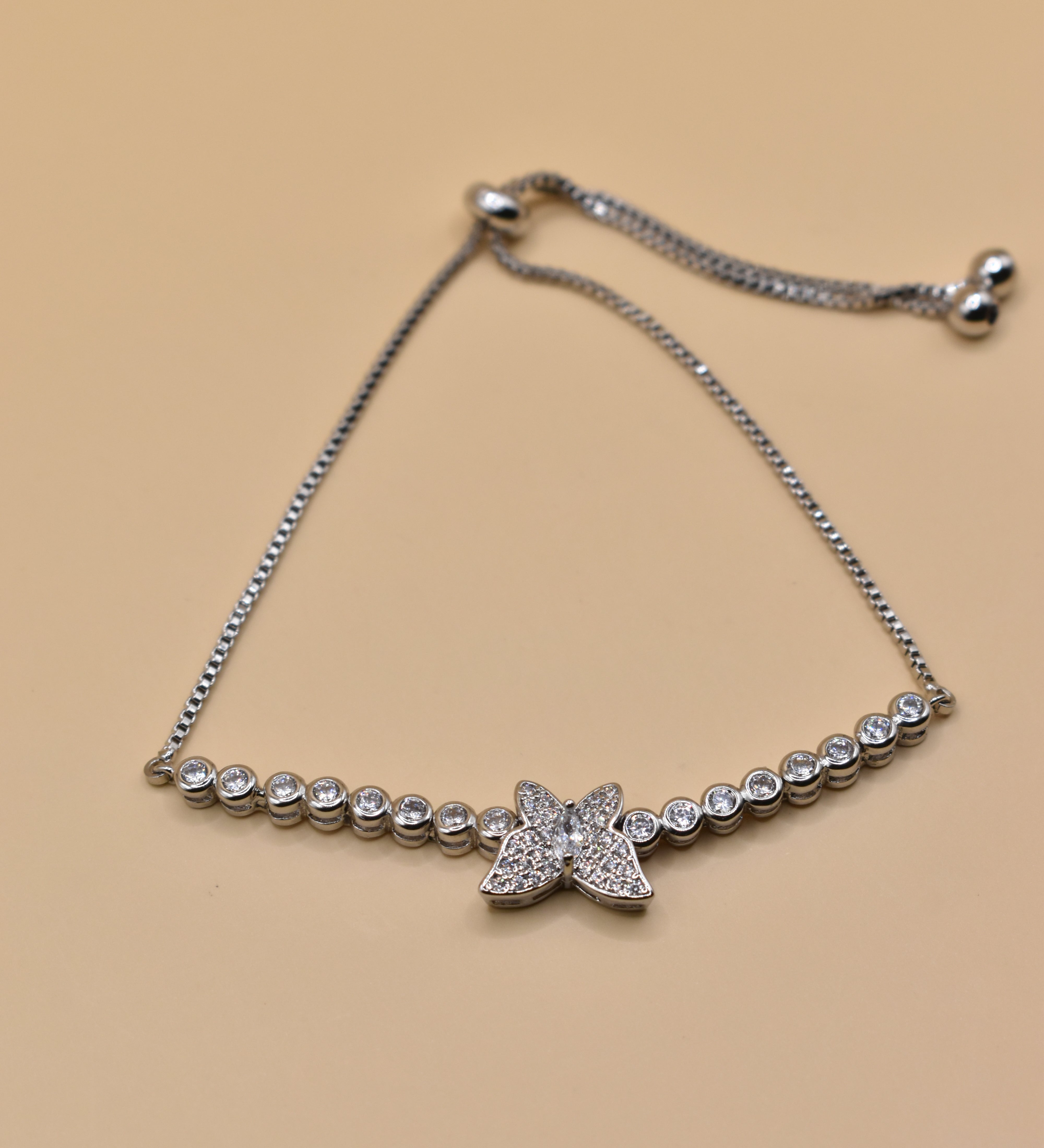 Butterfly cubic zirconia sliding rhodium plated bracelet