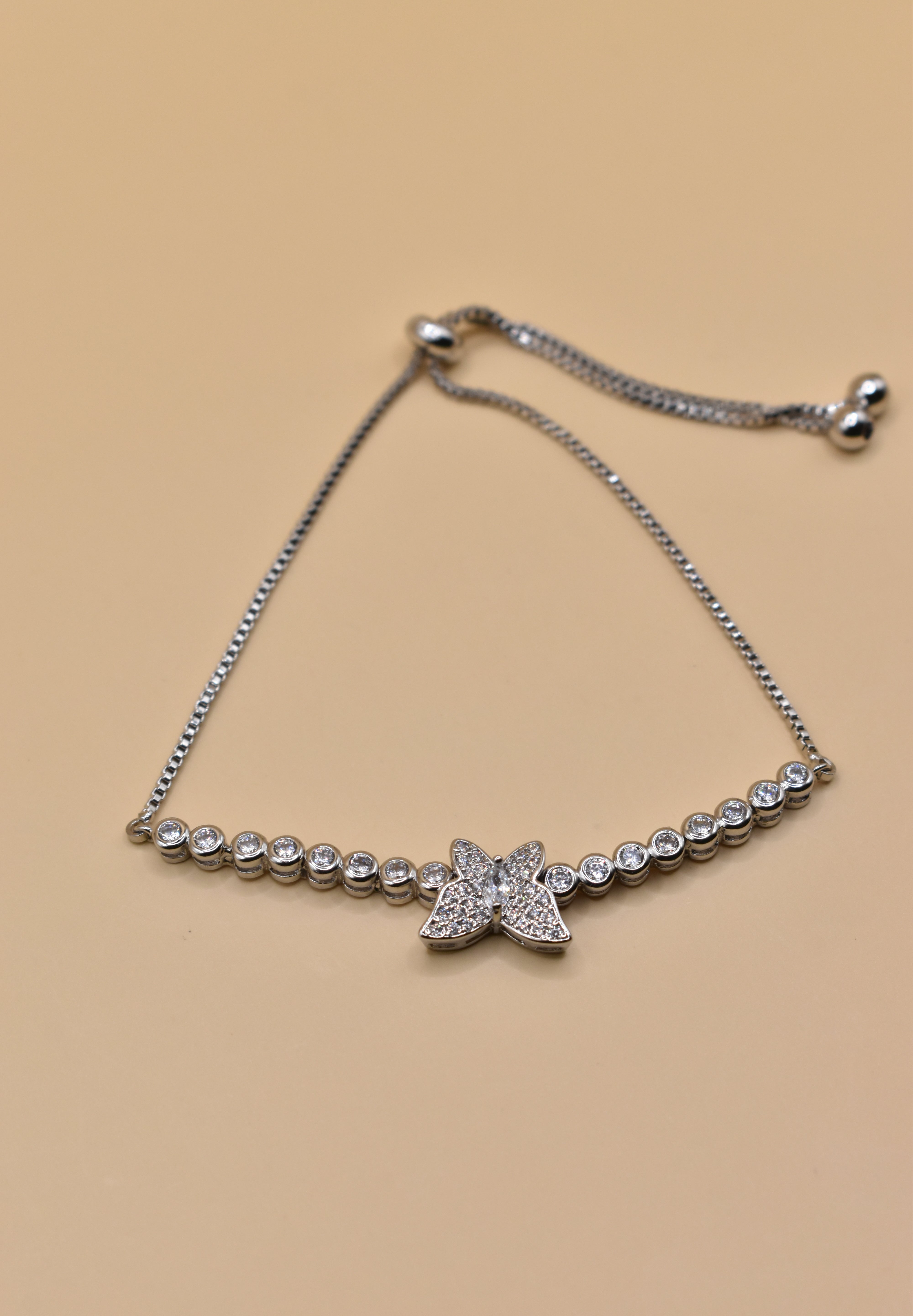 Butterfly cubic zirconia sliding rhodium plated bracelet