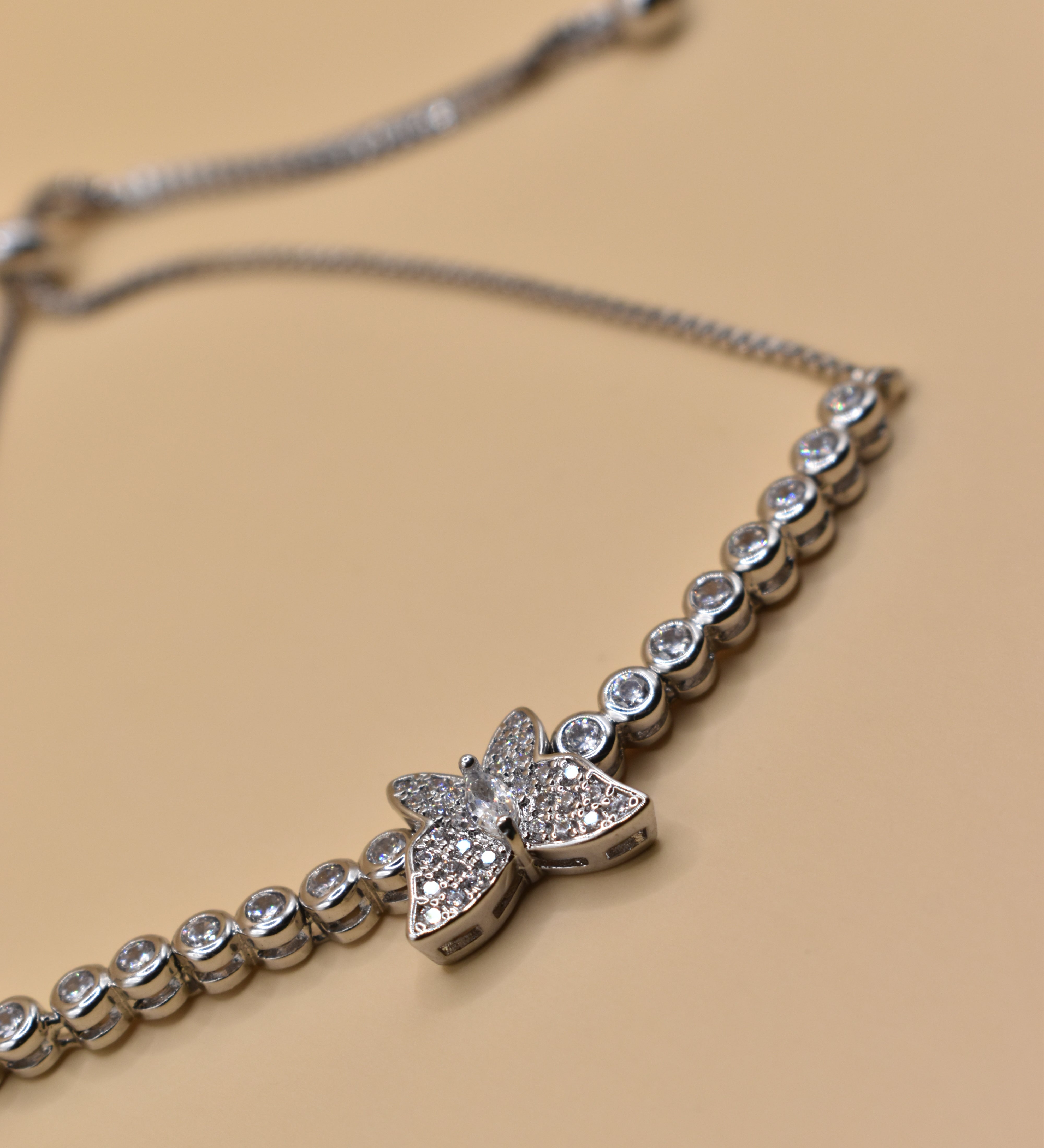 Butterfly cubic zirconia sliding rhodium plated bracelet