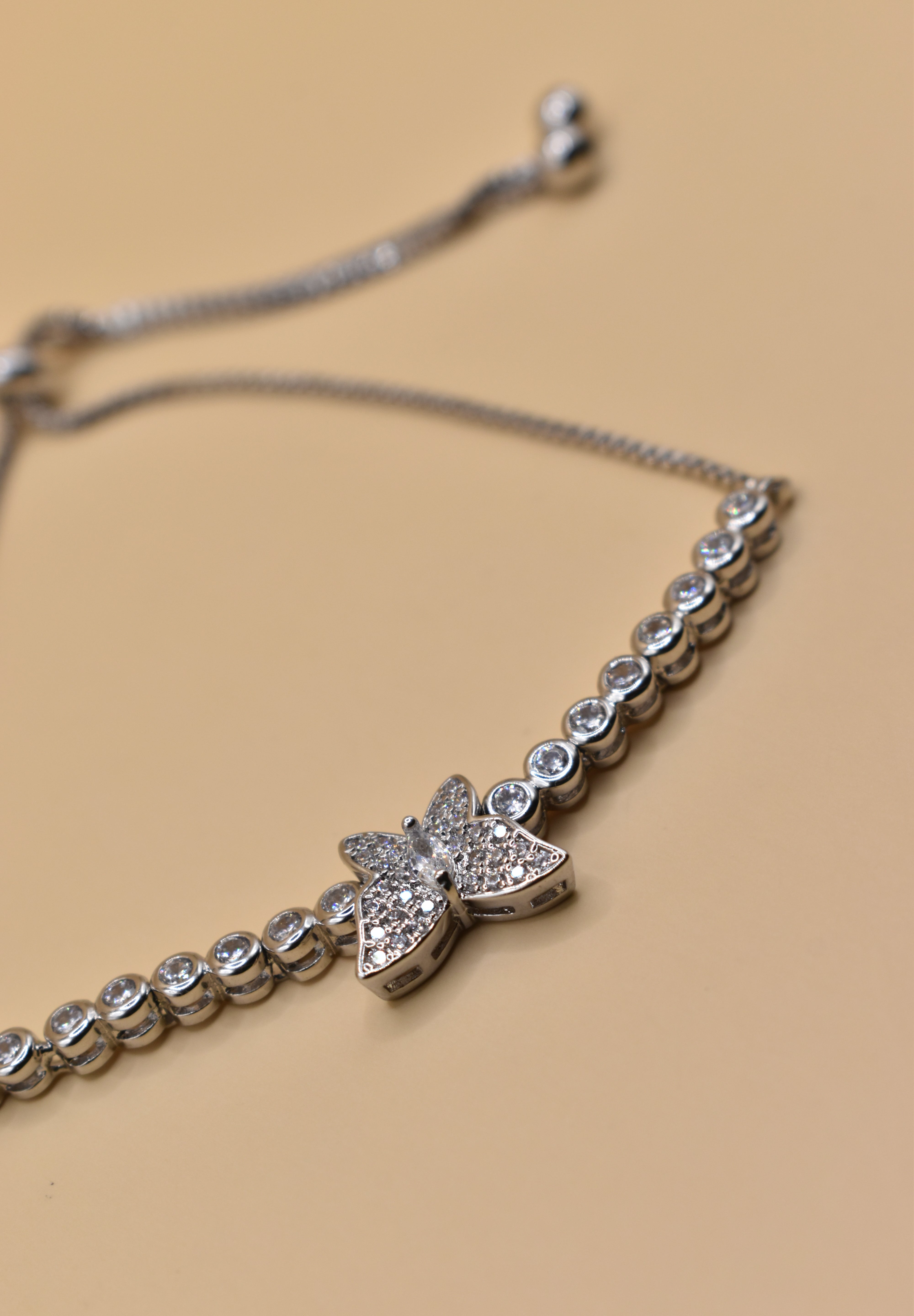 Butterfly cubic zirconia sliding rhodium plated bracelet
