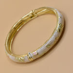 Vintage gold bangle bracelet with smooth round design