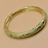 Vintage gold bangle bracelet with smooth round design