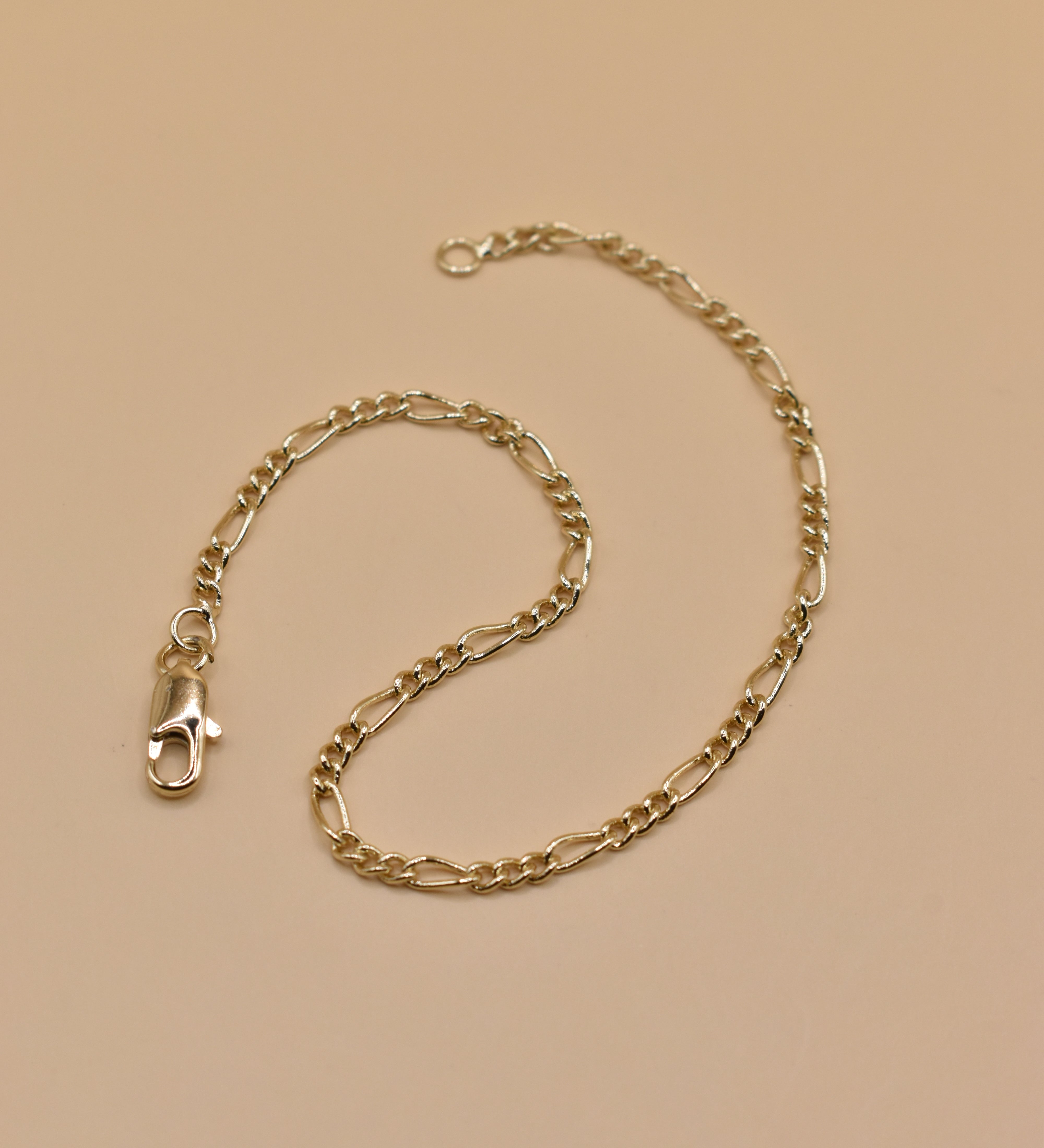 Thin gold chain bracelet with dainty link design