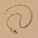 Thin gold chain bracelet with dainty link design