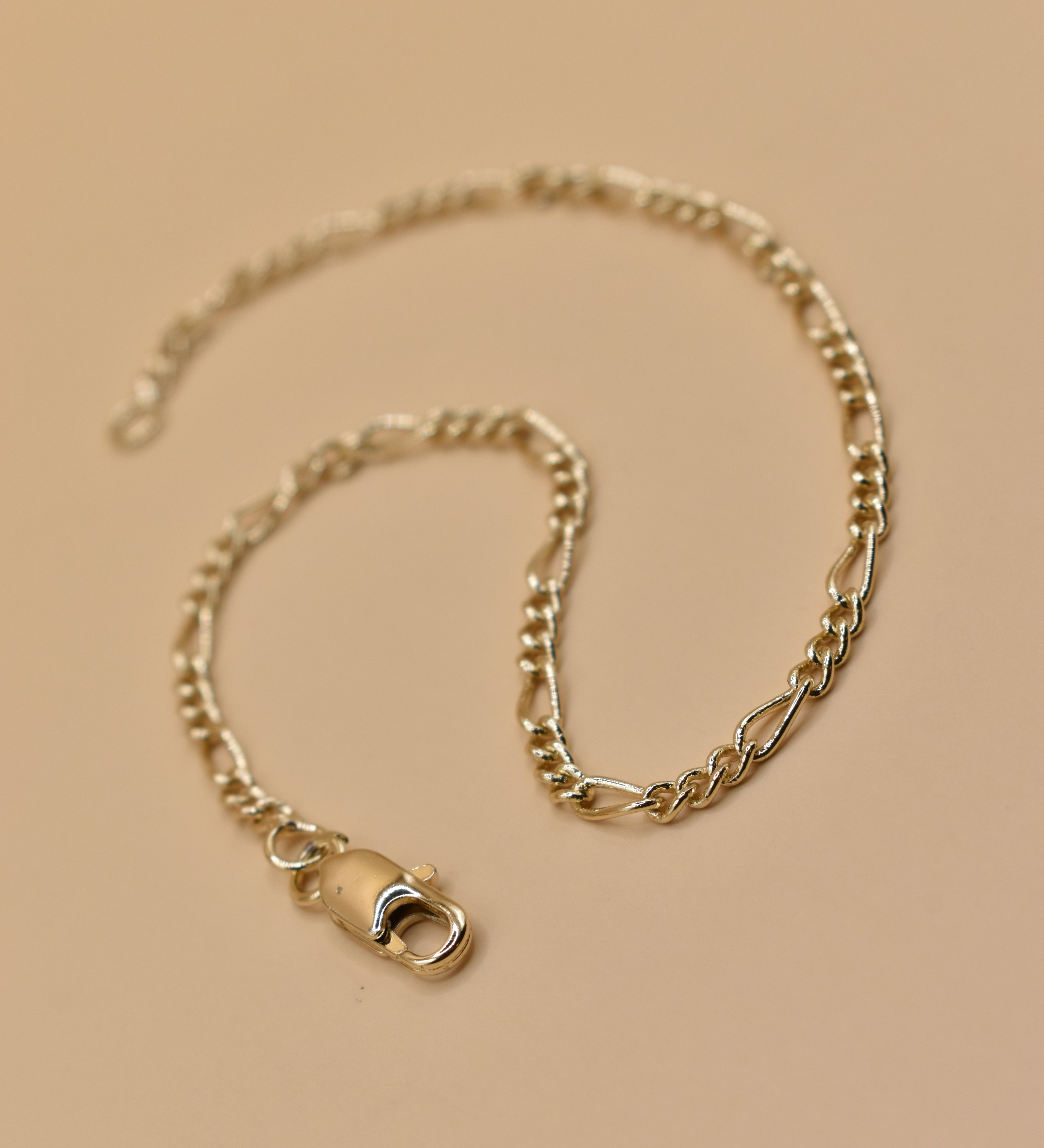 Thin gold chain bracelet with dainty link design