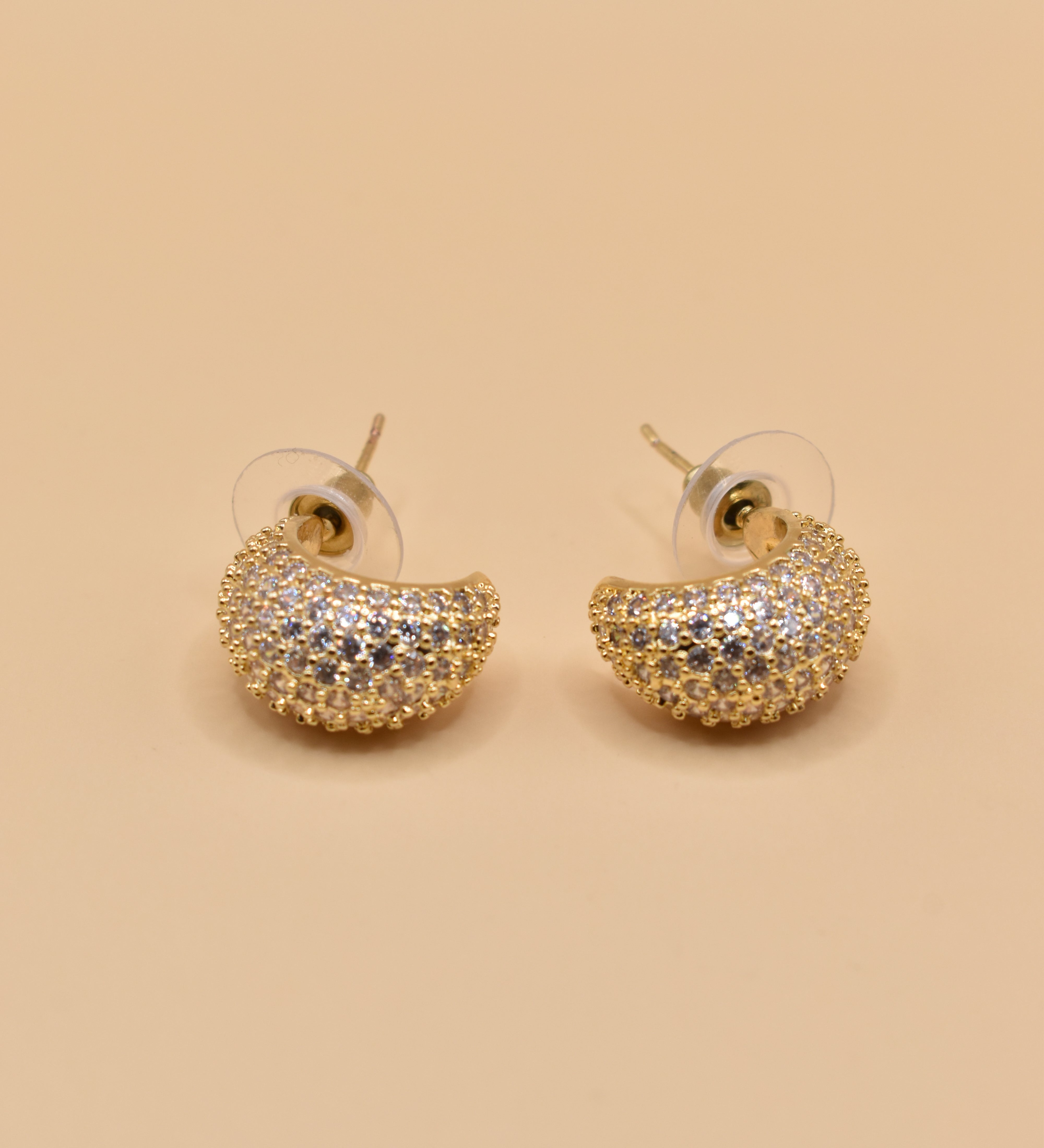 Gold dome rhinestone earrings with structured stud design