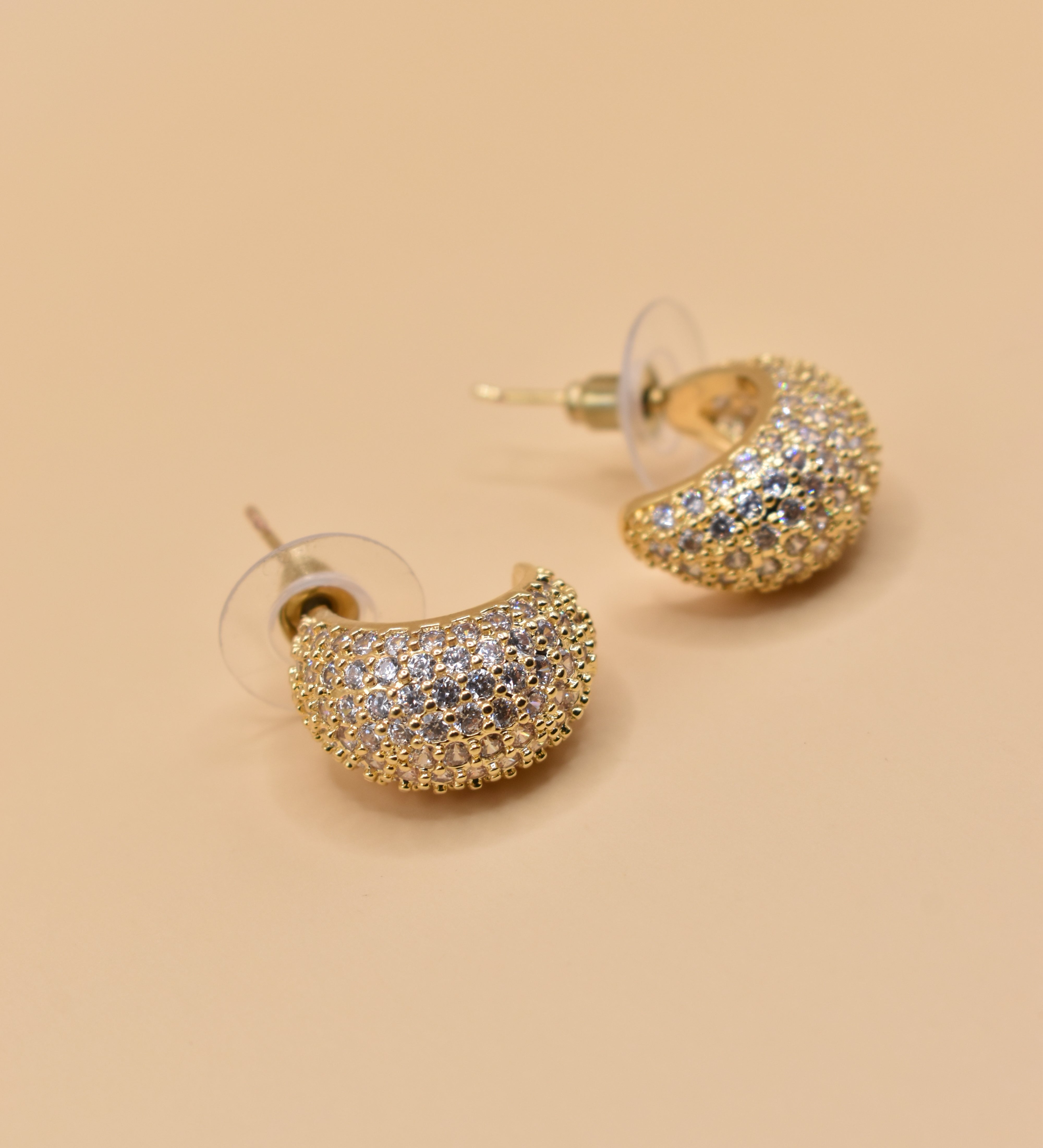 Gold dome rhinestone earrings with structured stud design