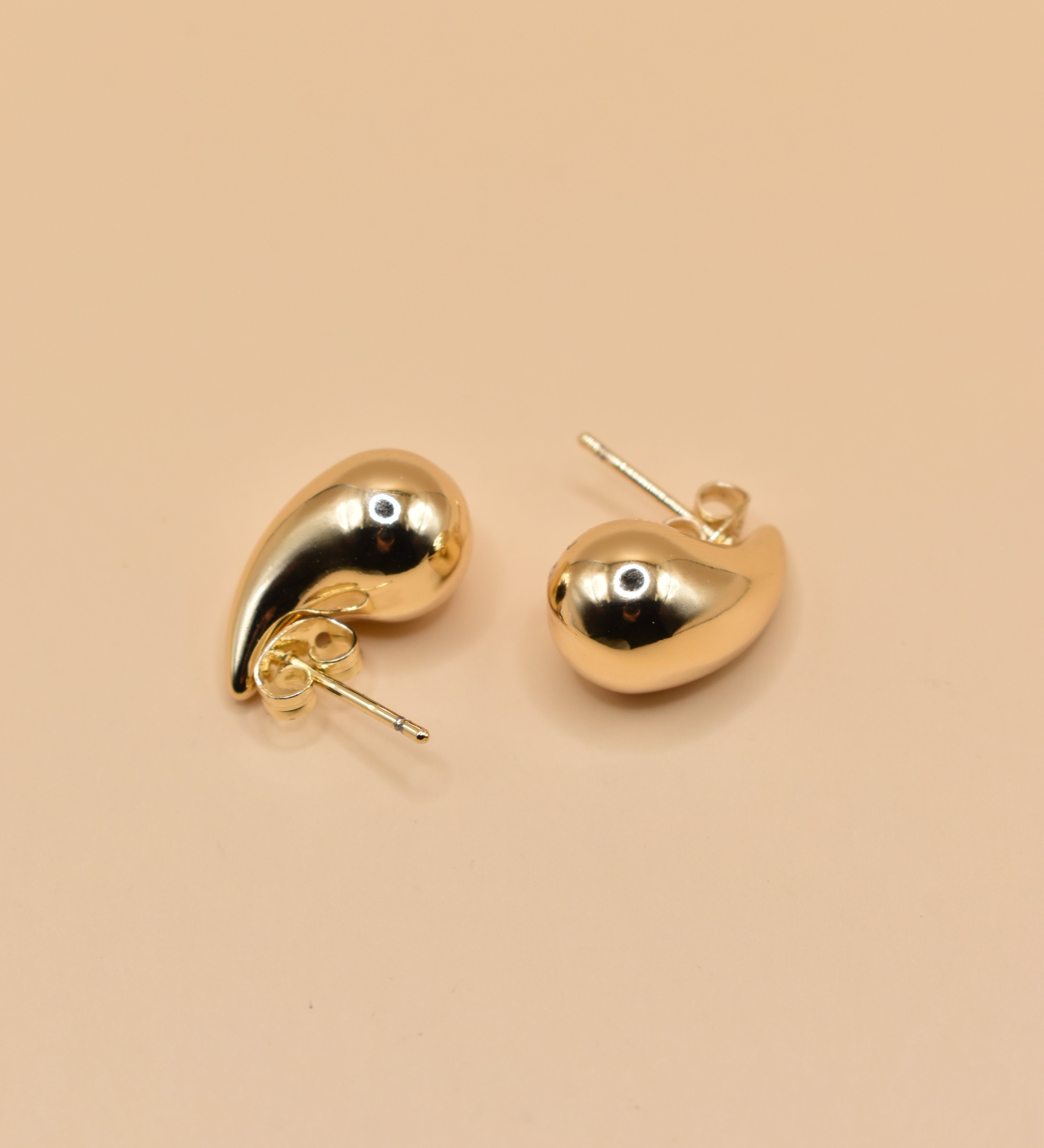 Small gold tear drop earrings in stainless steel finish