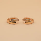 Gold loop huggies charm circle hoop earrings close-up