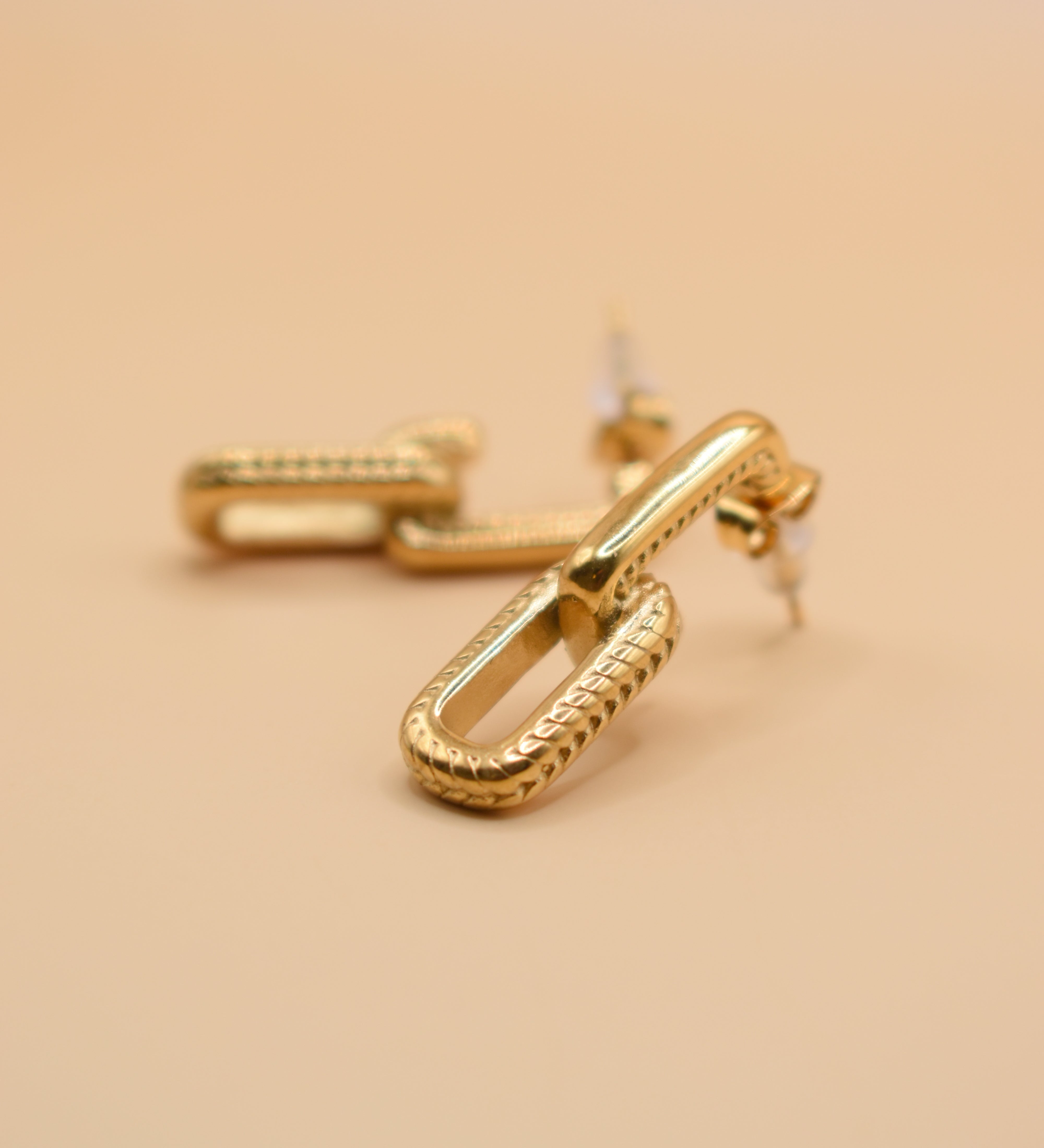 Gold link earrings with stainless steel weaved double design