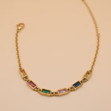 Stainless steel multicolor gold chain bracelet on white background