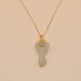 Gold key pendant necklace with jade charm on dainty chain